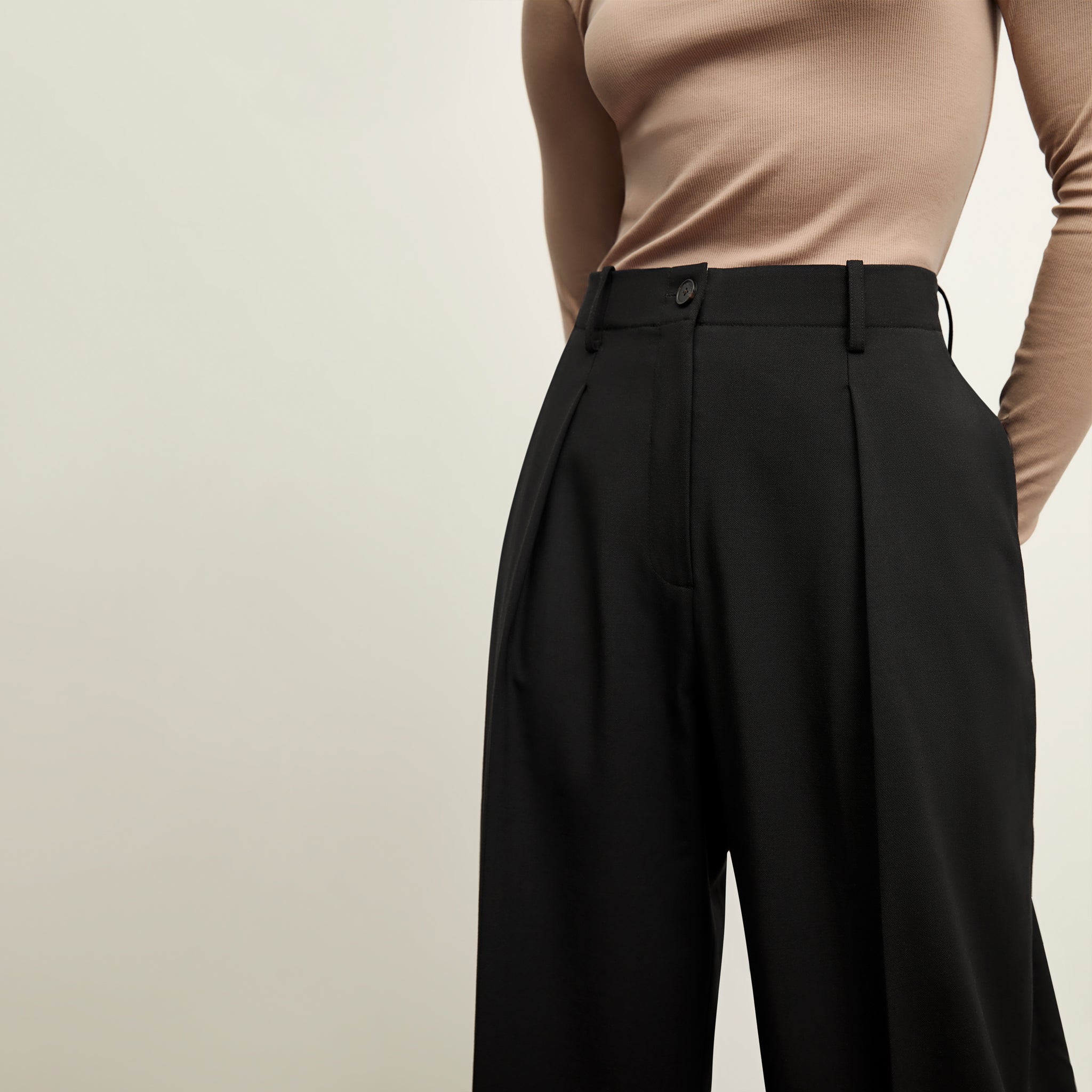 detail image of a woman wearing the zuri pant in black
