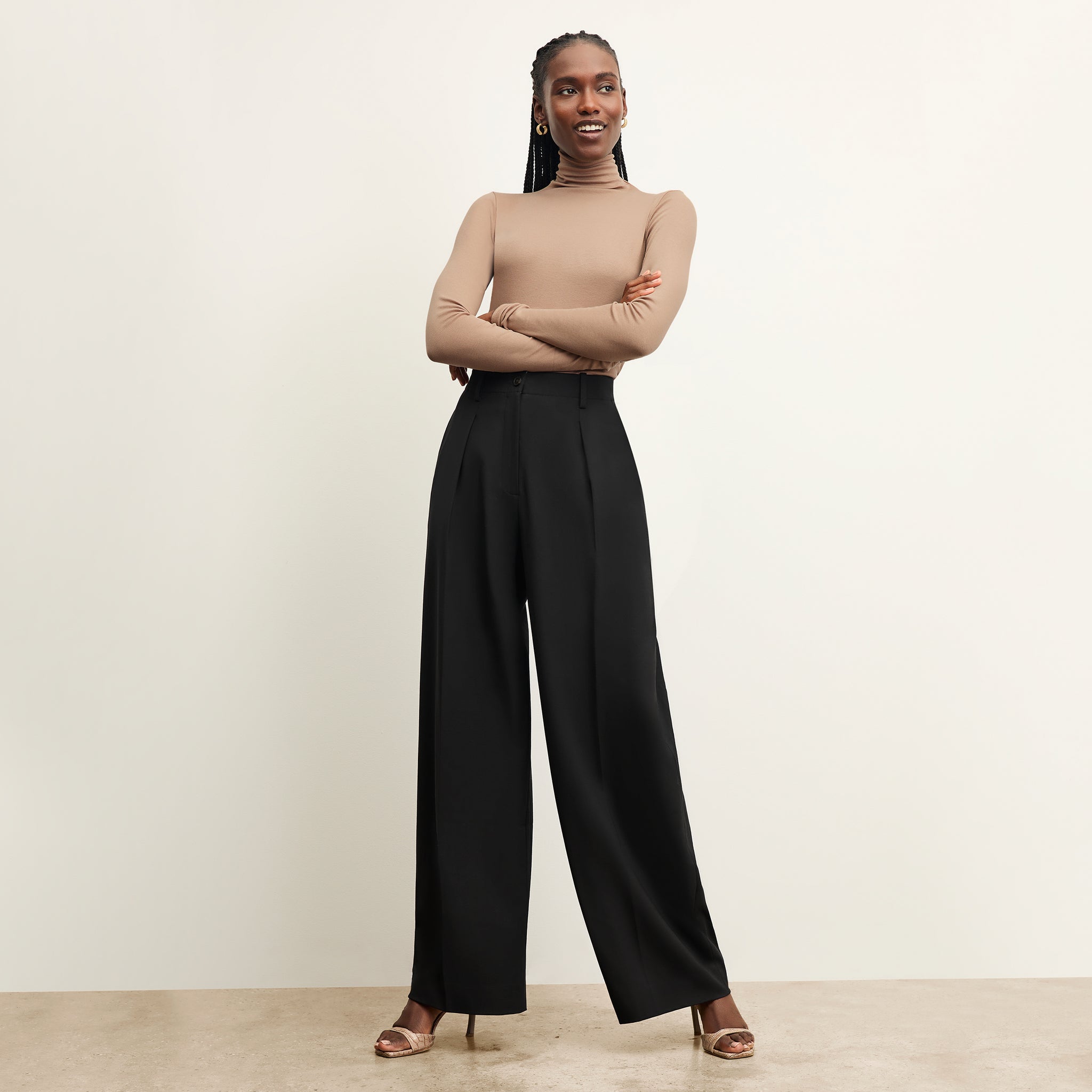 front image of a woman wearing the zuri pant in black 