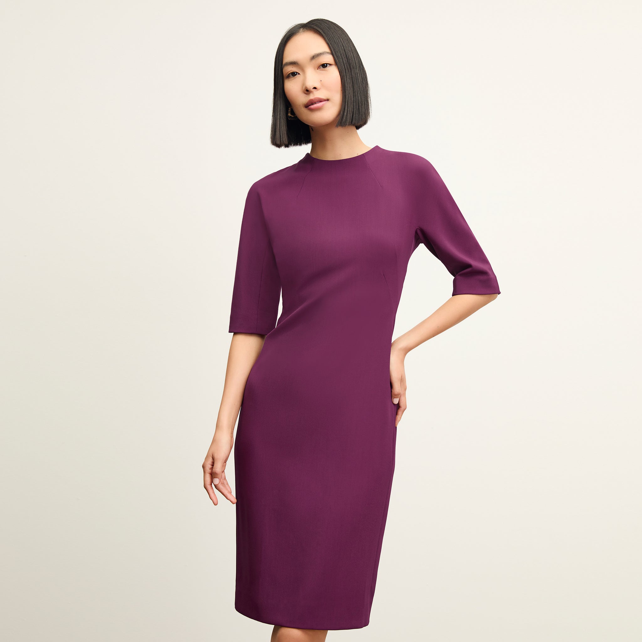 front image of a woman wearing the farnoosh dress in plumberry 