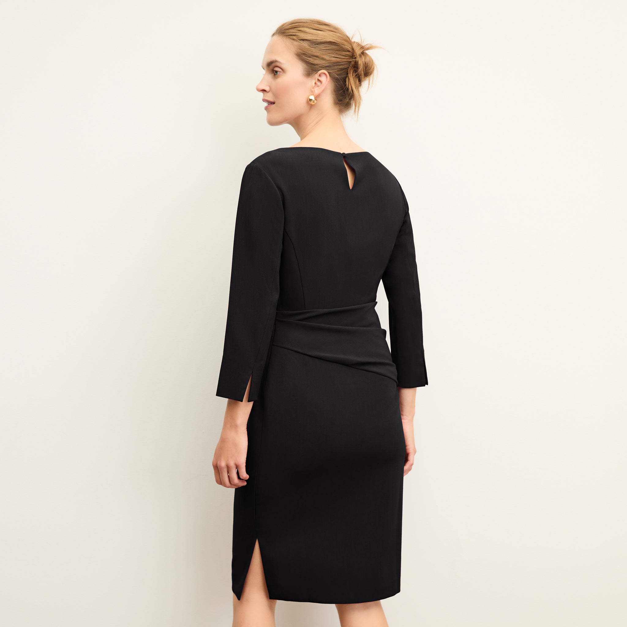 back image of a woman wearing the maxine dress in black 