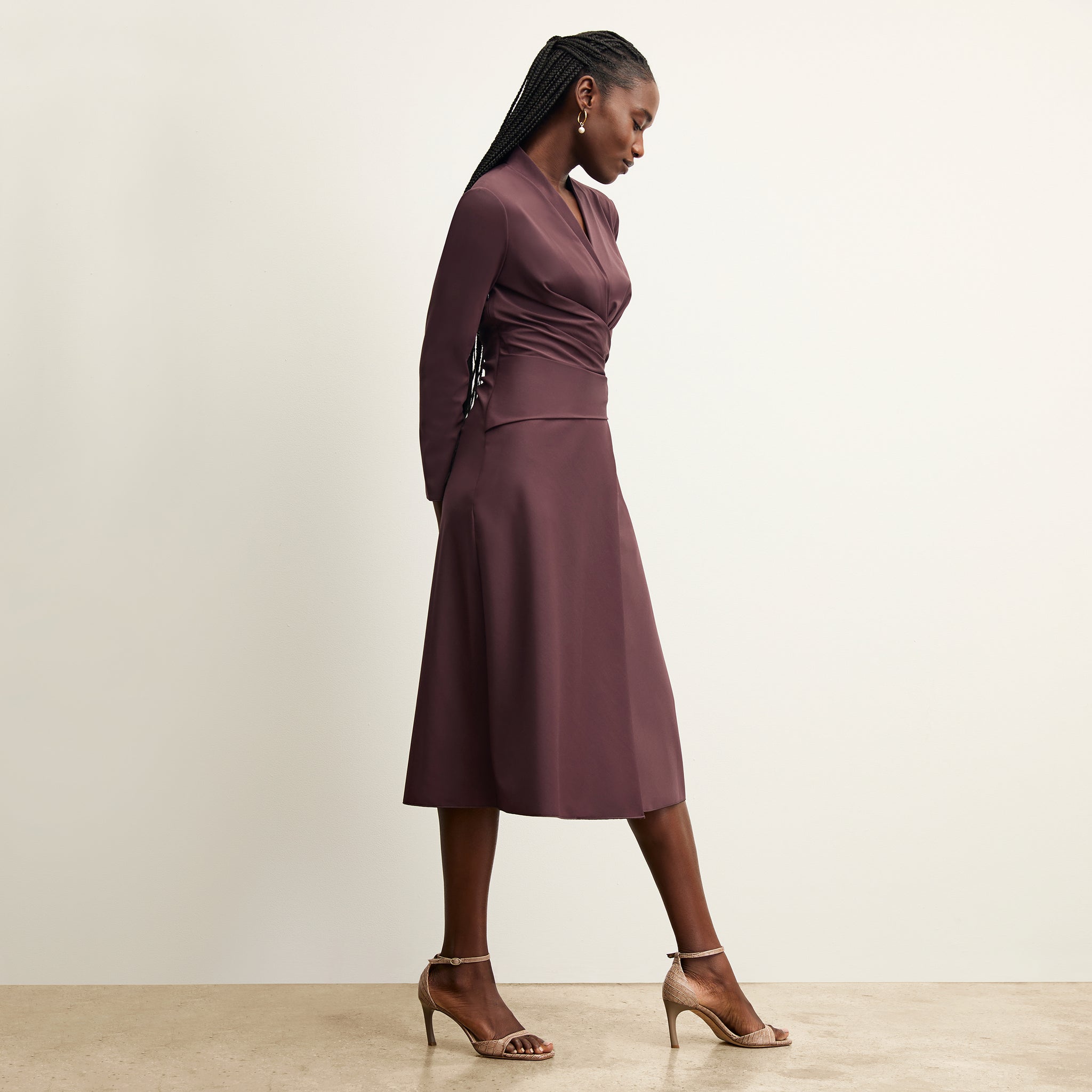side image of a woman wearing the carly dress in grape