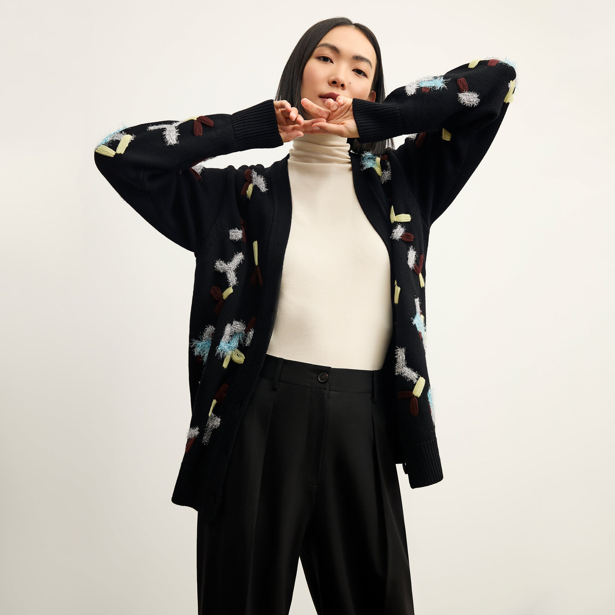 front image of a woman wearing the cookie cardigan in confetti 