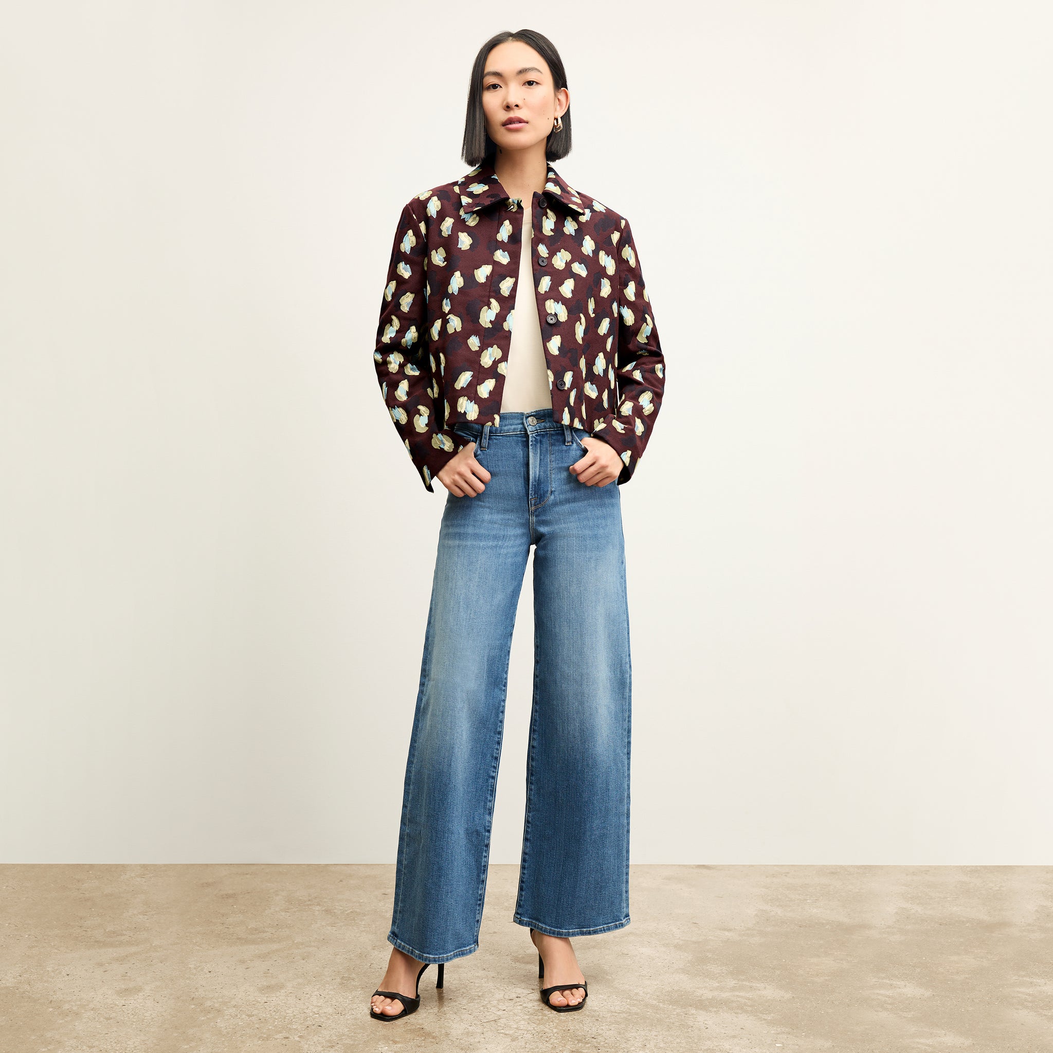 front image of a woman wearing the FRAME le slim palazzo jeans in drizzle 
