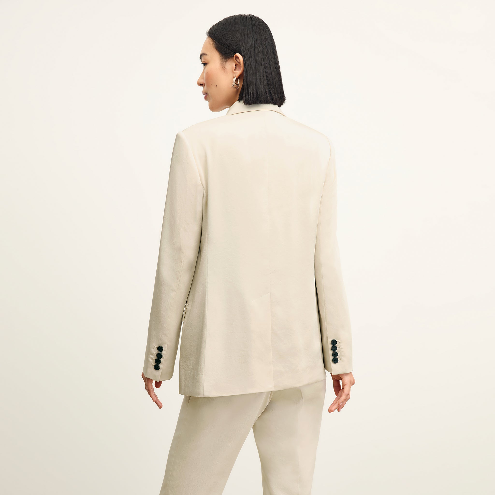 Back image of a woman wearing the o'hara jacket in champagne