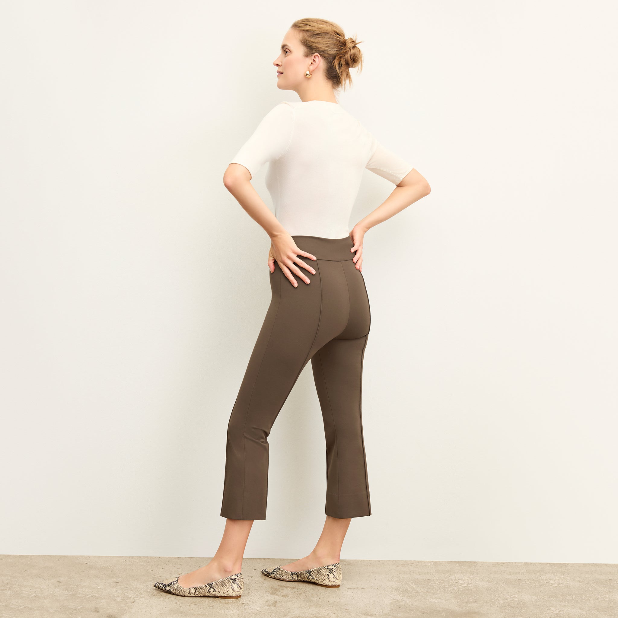 Back image of a woman wearing the allyn pants in ash