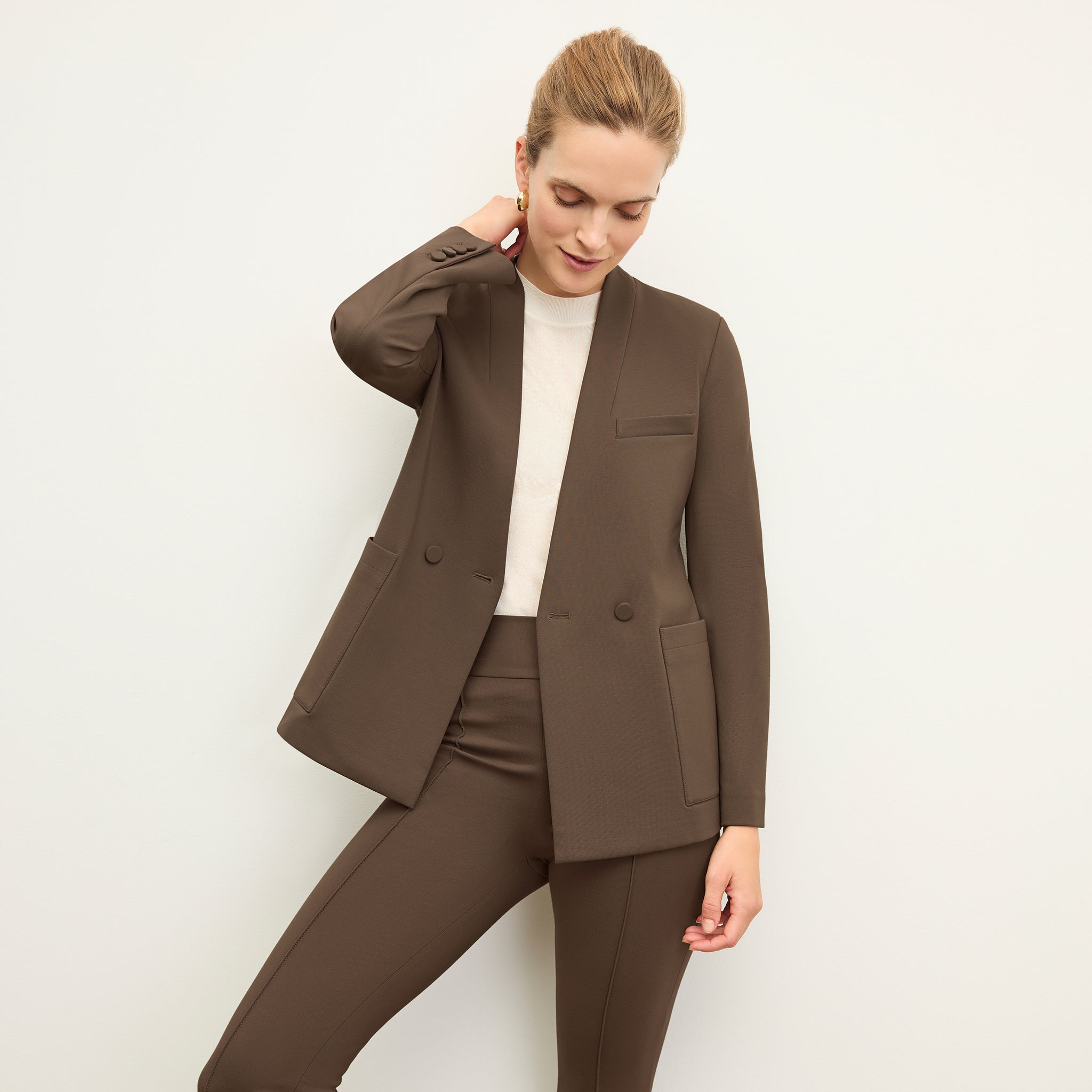 Front image of a woman wearing the allyn pants in ash