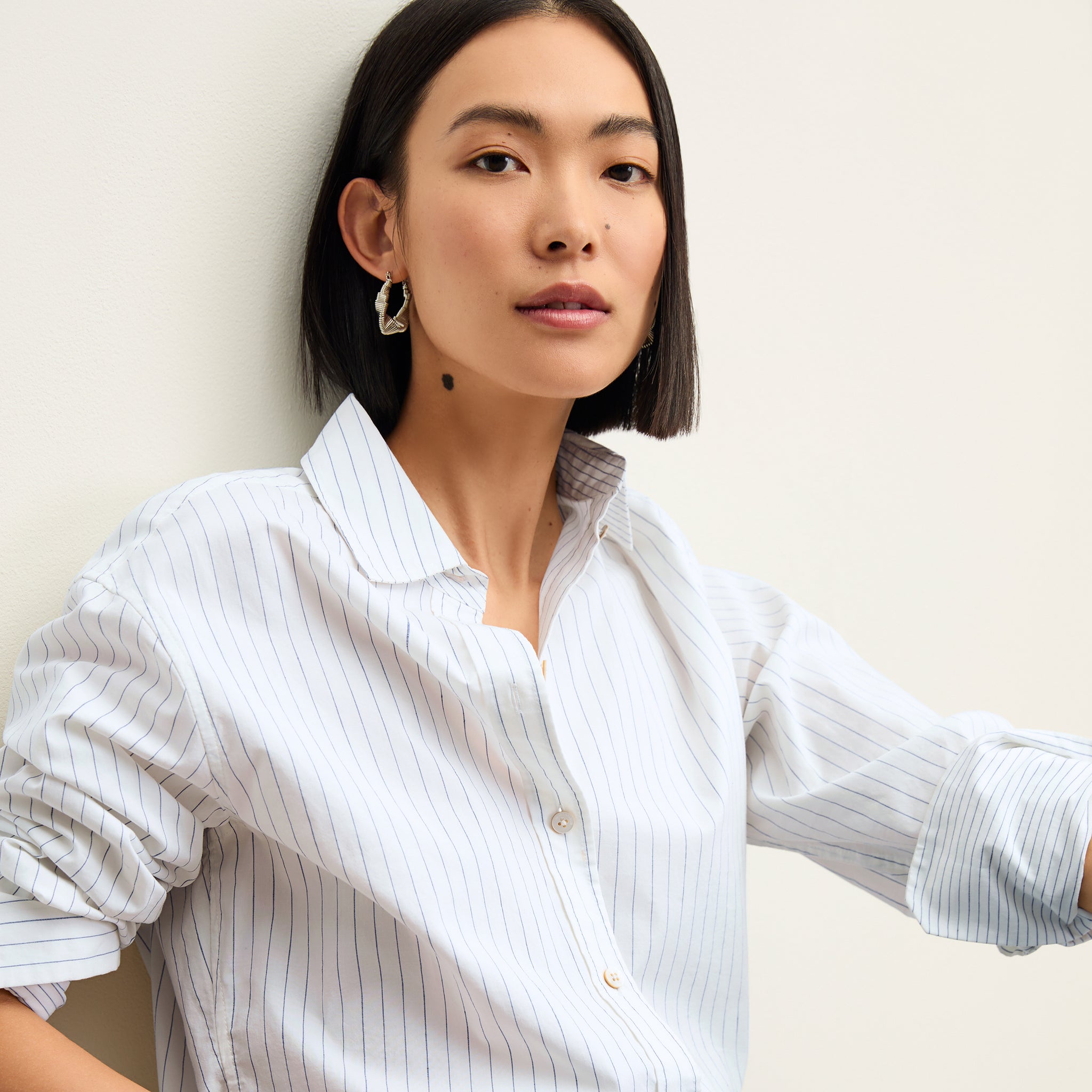 Front image of a woman wearing the Mila Button Down - Poplin Stripe in Blue / Ivory