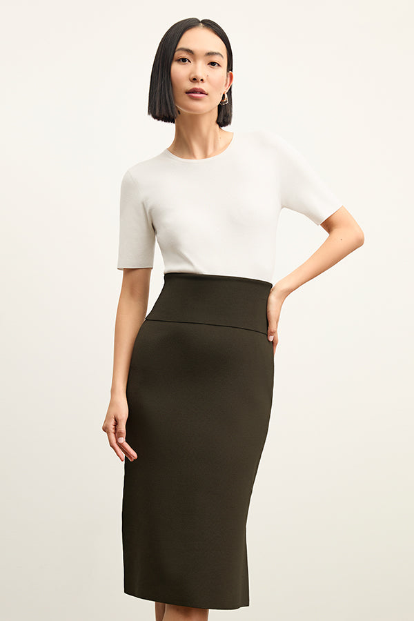 back image of a woman wearing the harlem skirt in dark elm