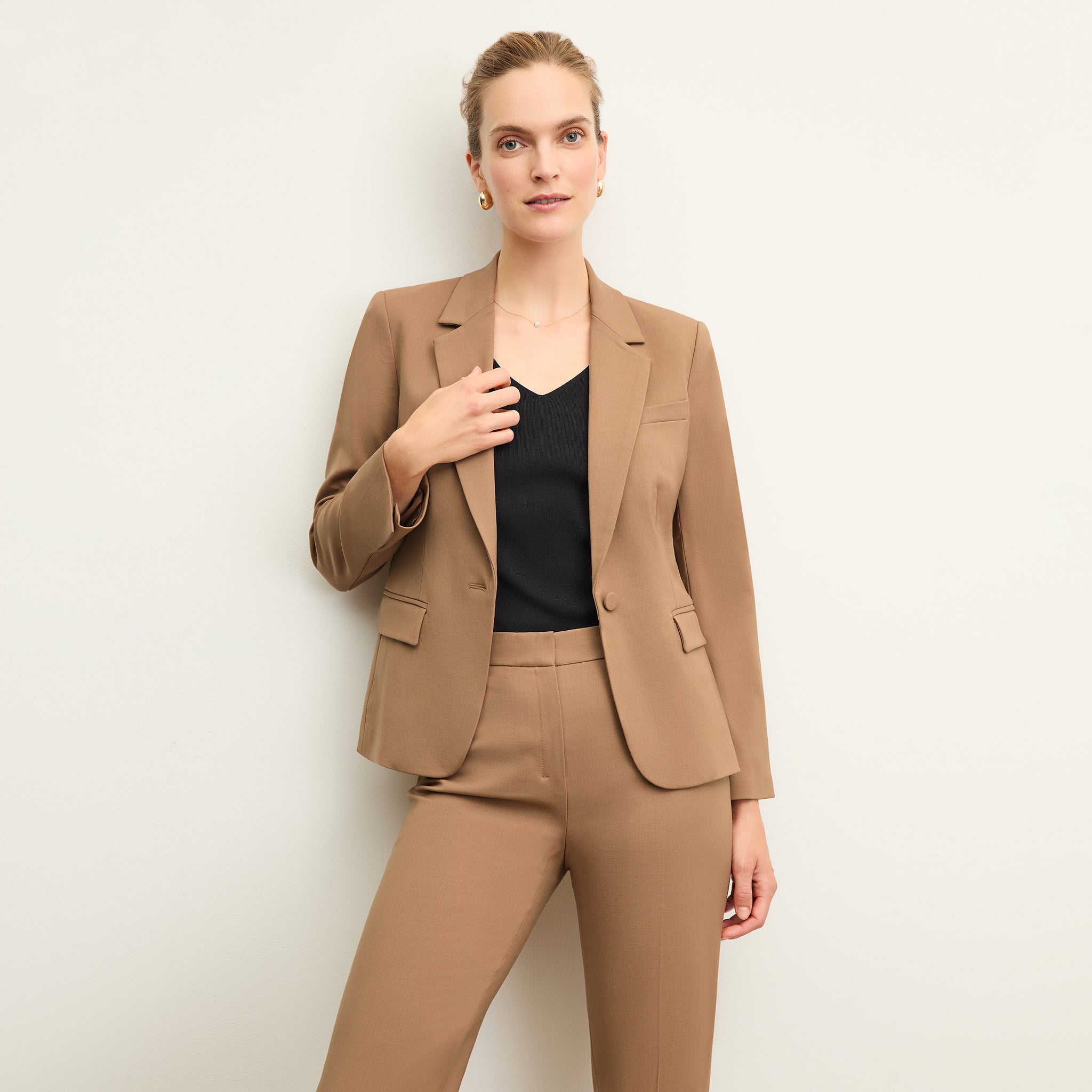 front image of a woman wearing the yasmine blazer in camel 