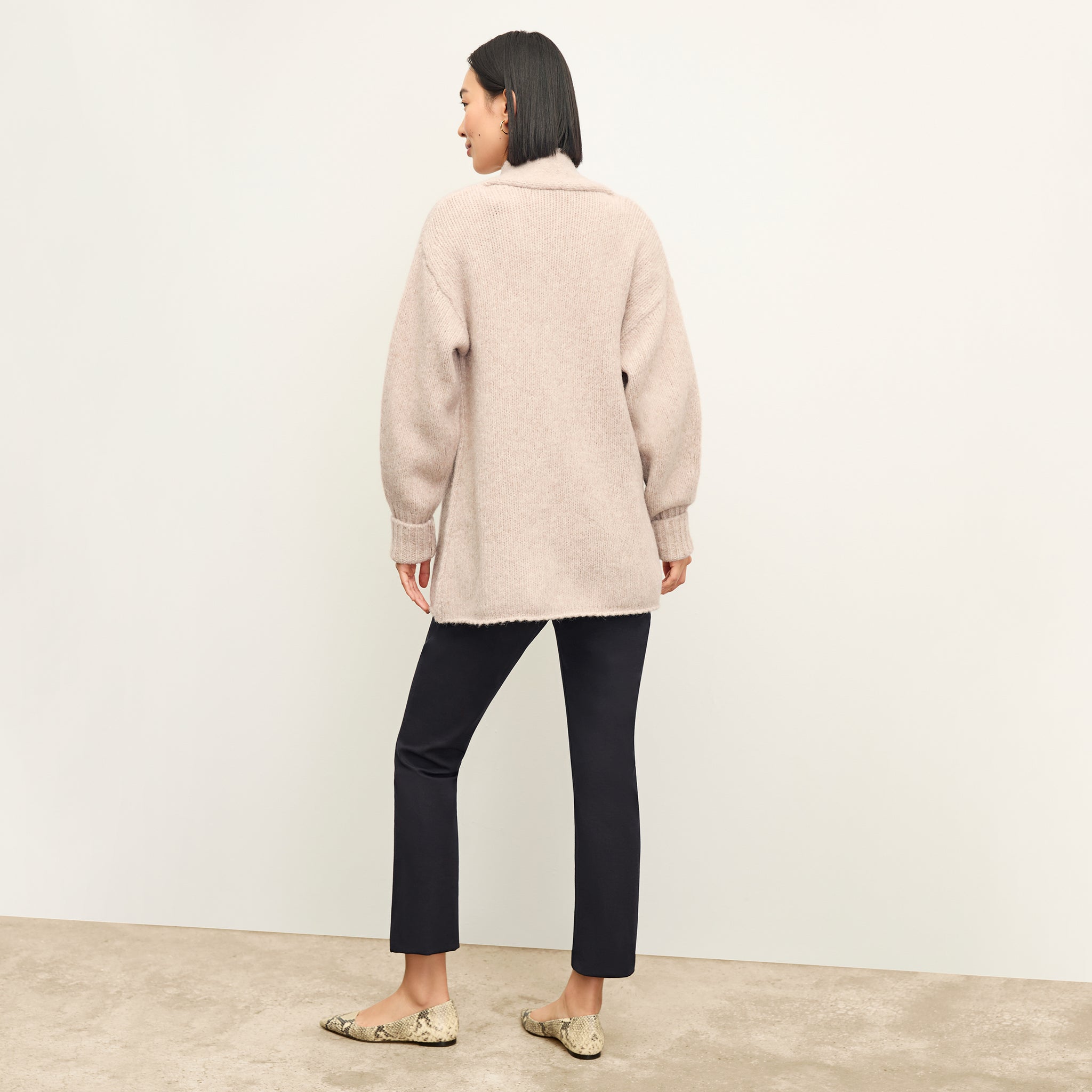 back image of a woman wearing the frederick cardigan in Walnut