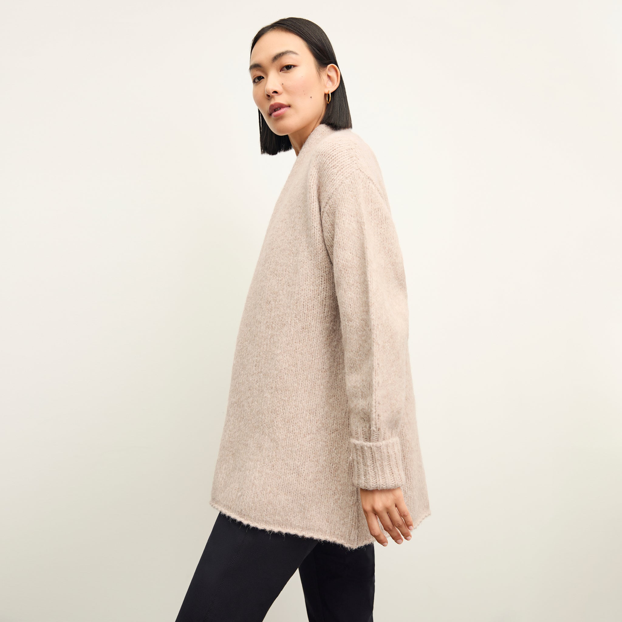 side image of a woman wearing the frederick cardigan in Walnut