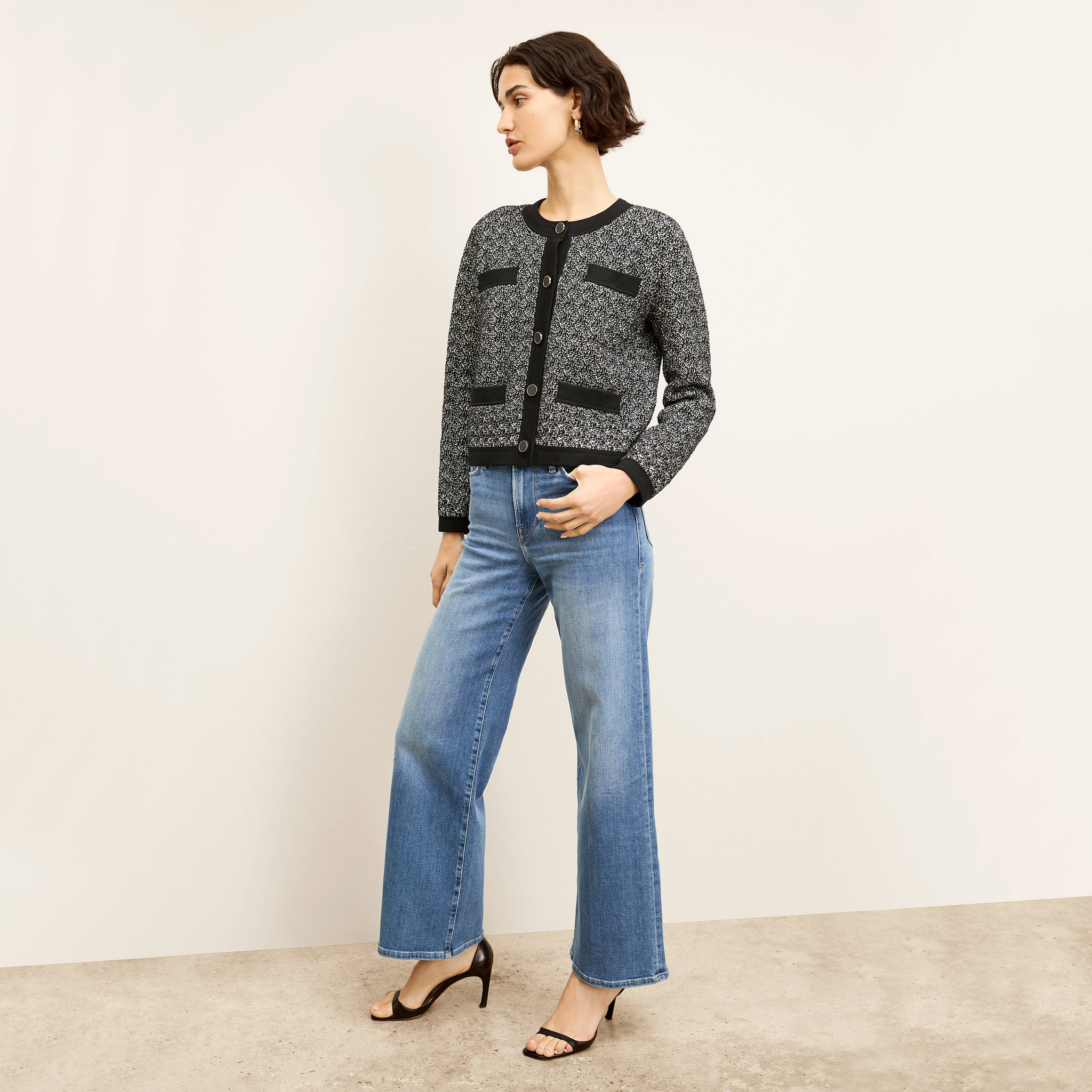 front image of a woman wearing the FRAME le slim palazzo jeans in drizzle