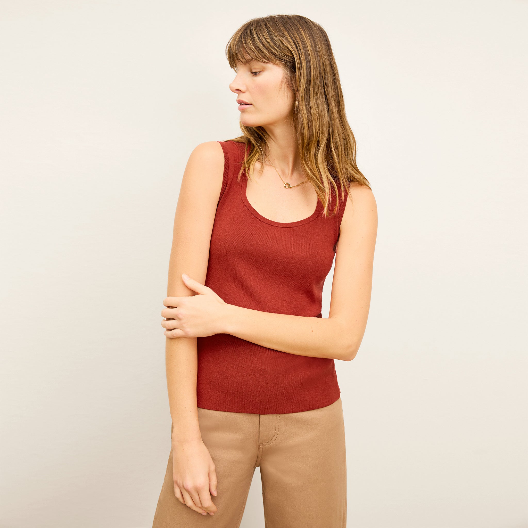 front image of a woman wearing the sabine top in amaro 