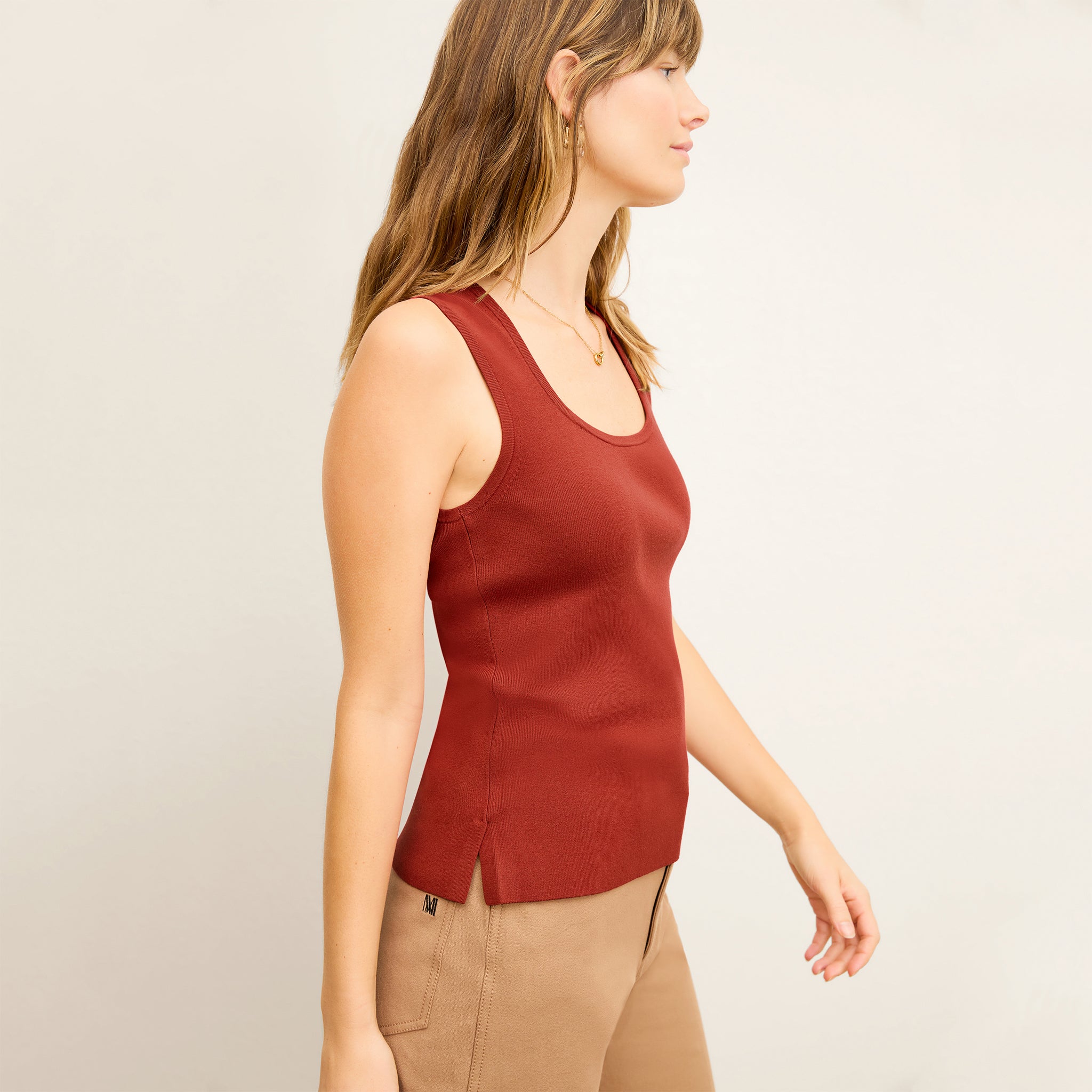 side image of a woman wearing the sabine top in amaro