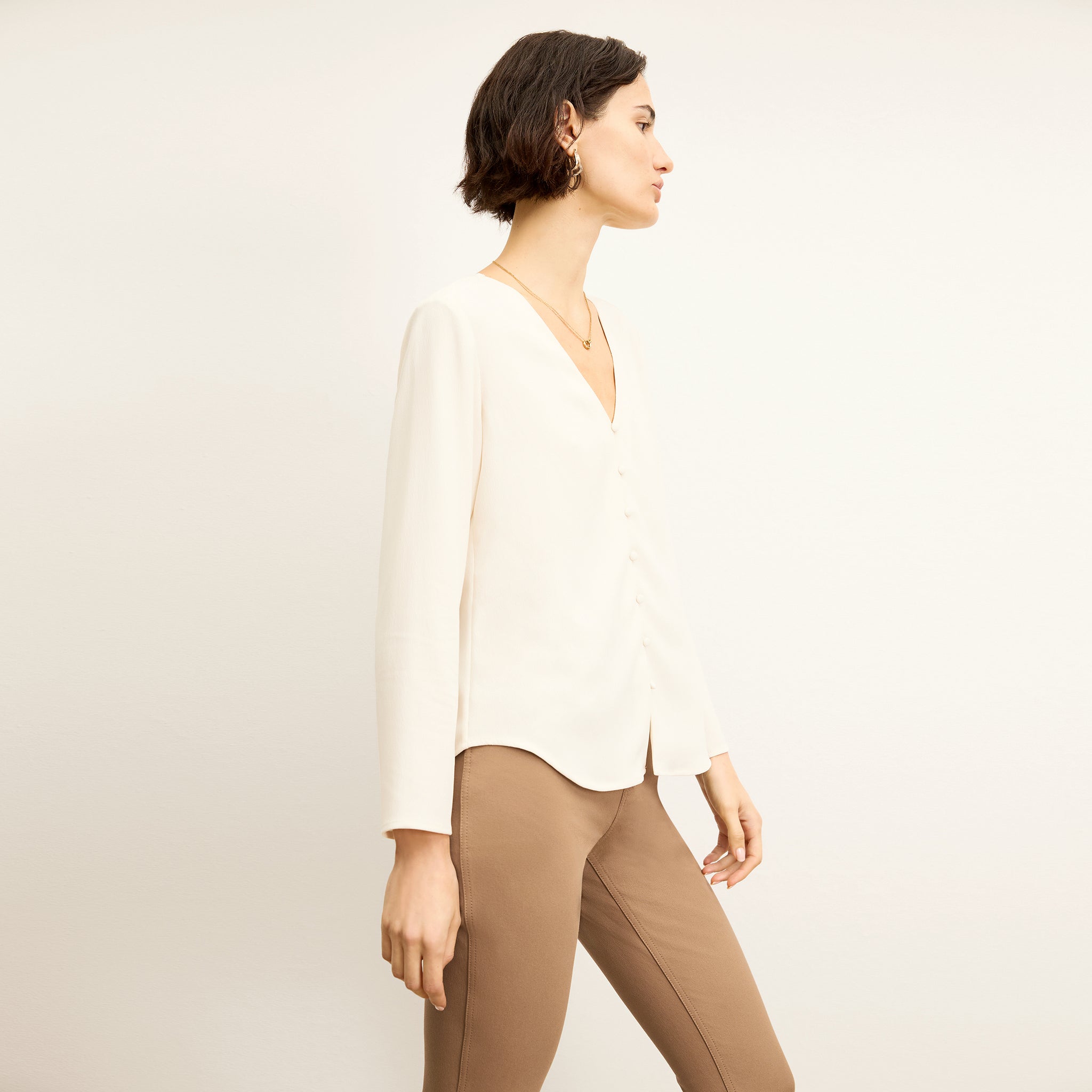 side image of a woman wearing the bobbie top in alabaster