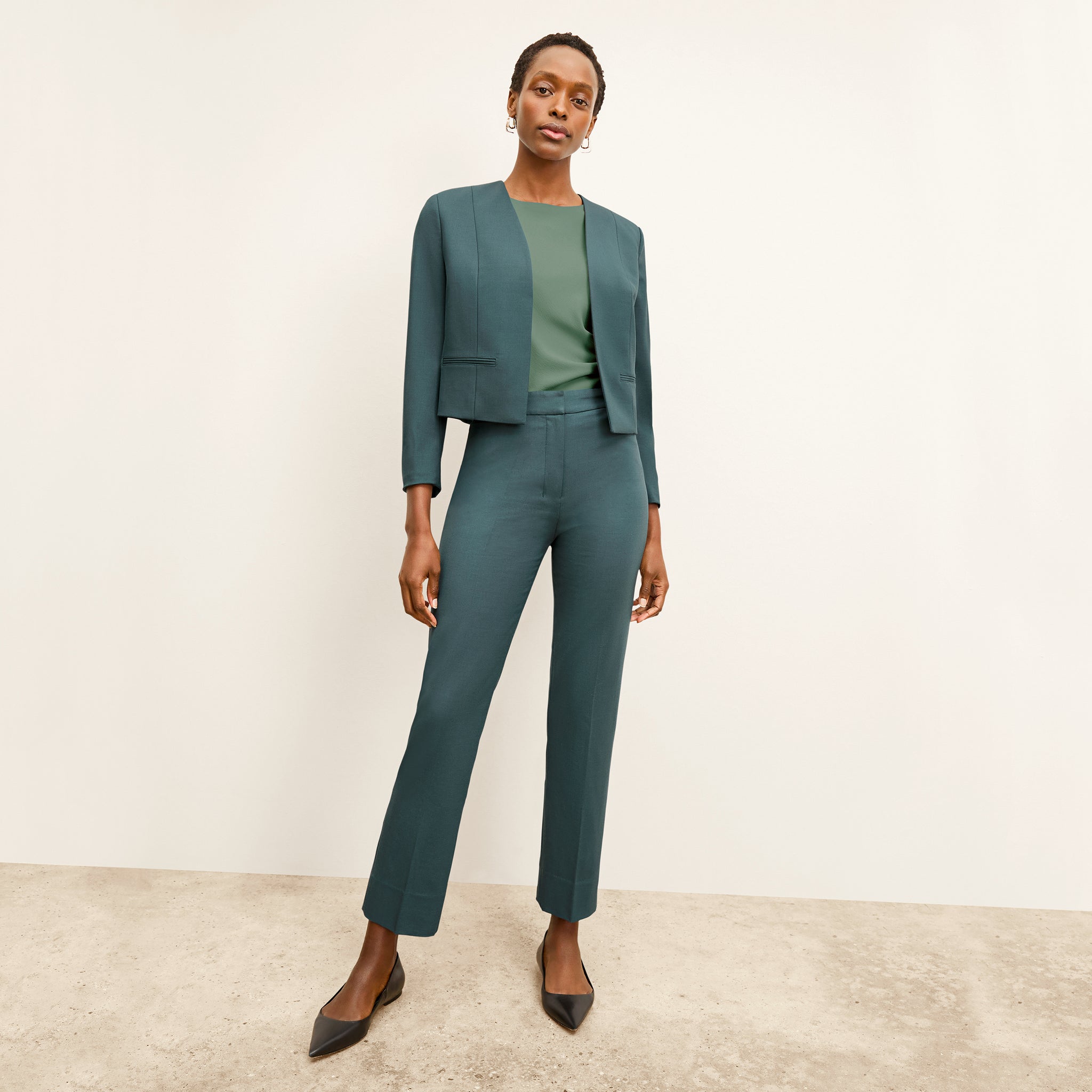 front image of a woman wearing the smith pants in blue jade