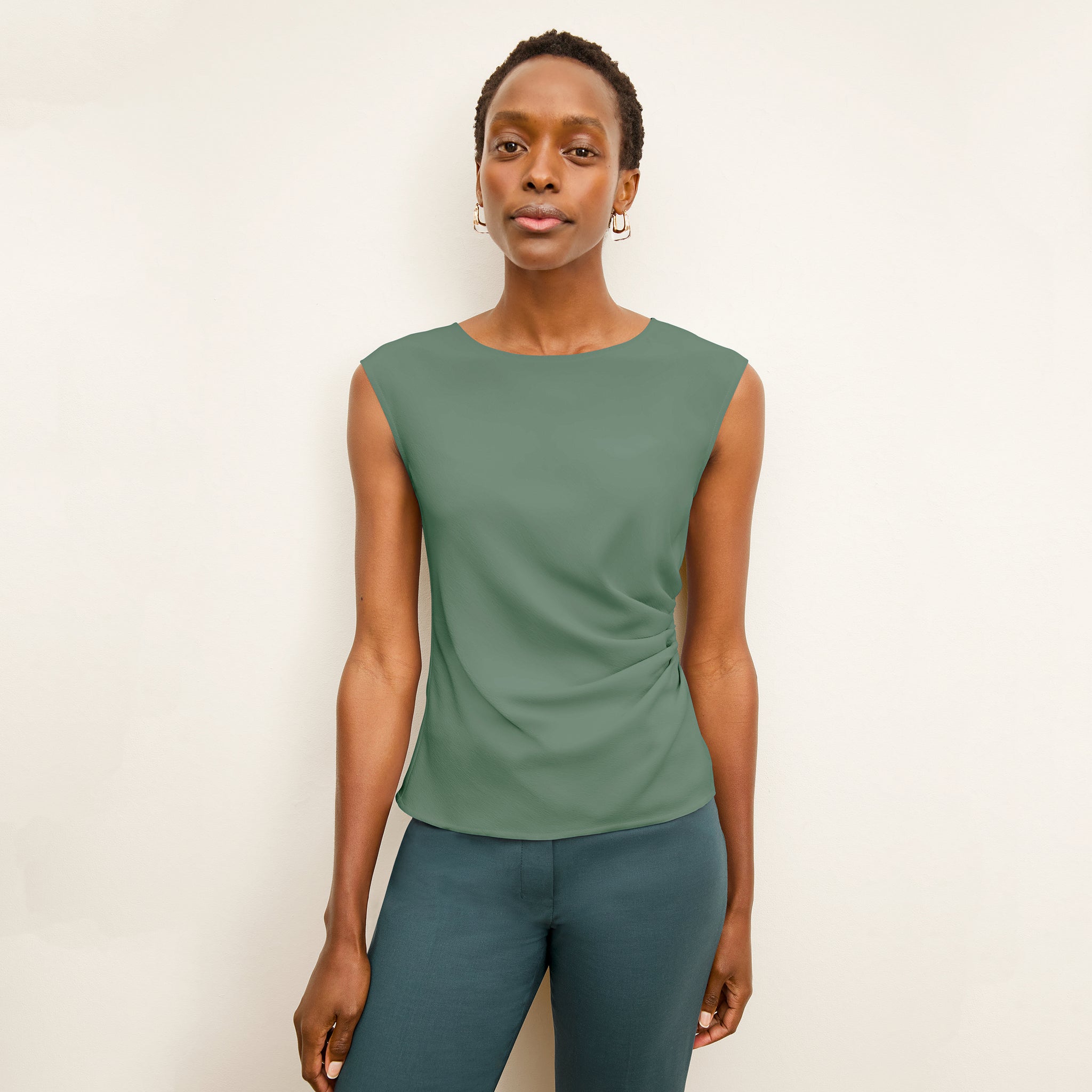 front image of a woman wearing the brooke top in riverstone 