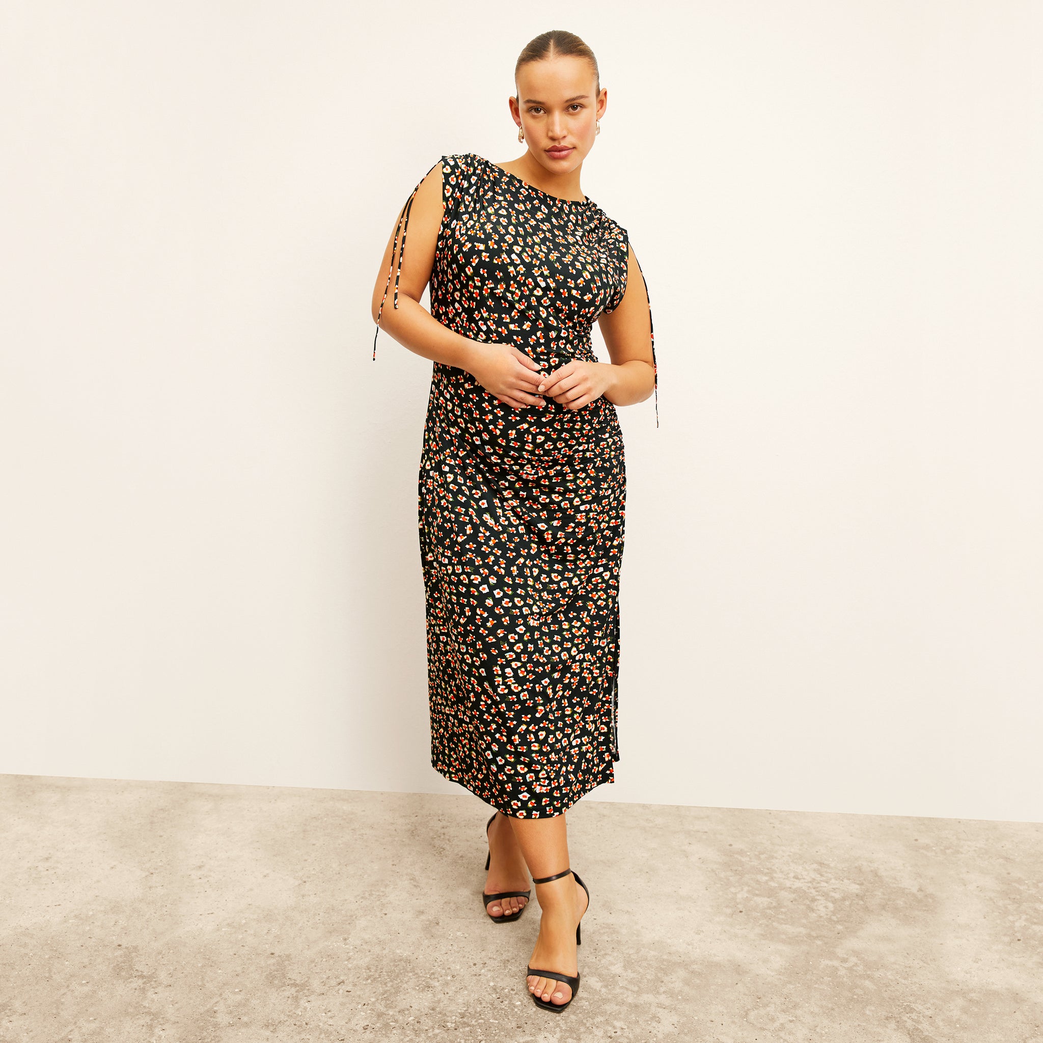 front image of a woman wearing the aisling dress in kaleidoscope print