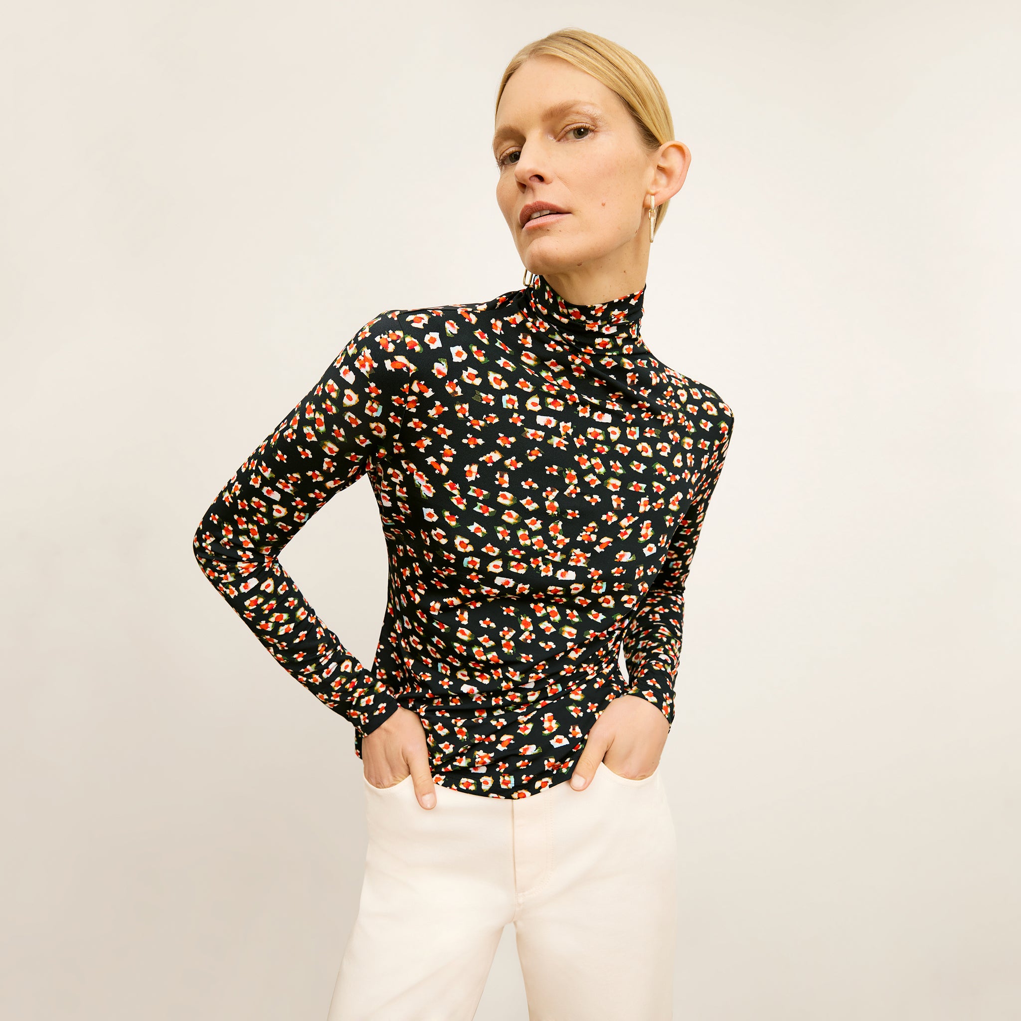 front image of a woman wearing the axam top in kaleidoscope print 