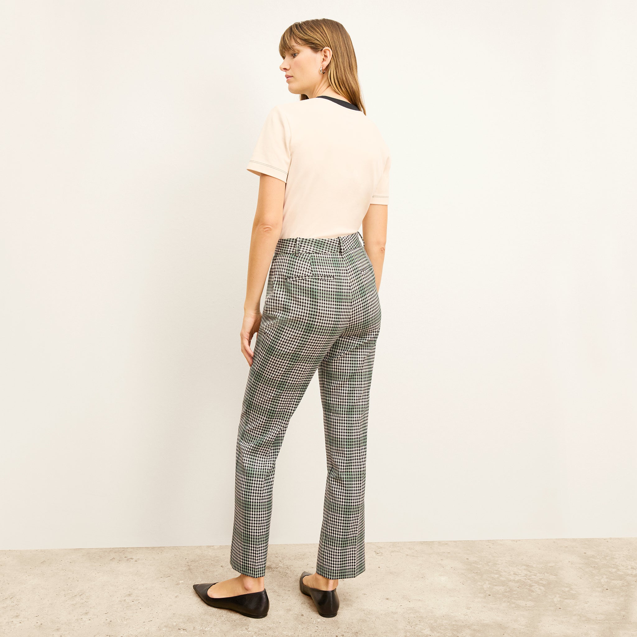 back image of a woman wearing the smith pant in check plaid