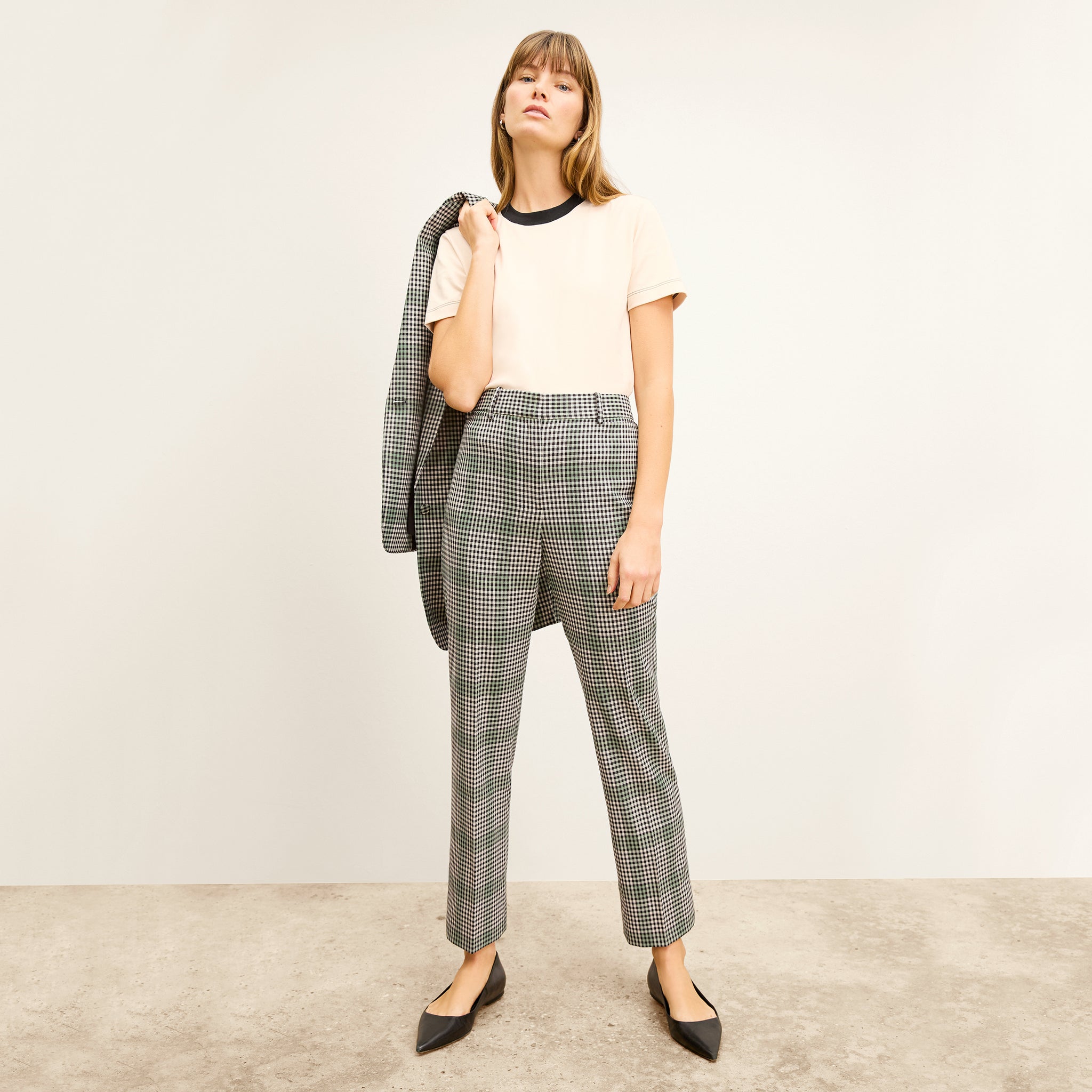 front image of a woman wearing the smith pant in check plaid