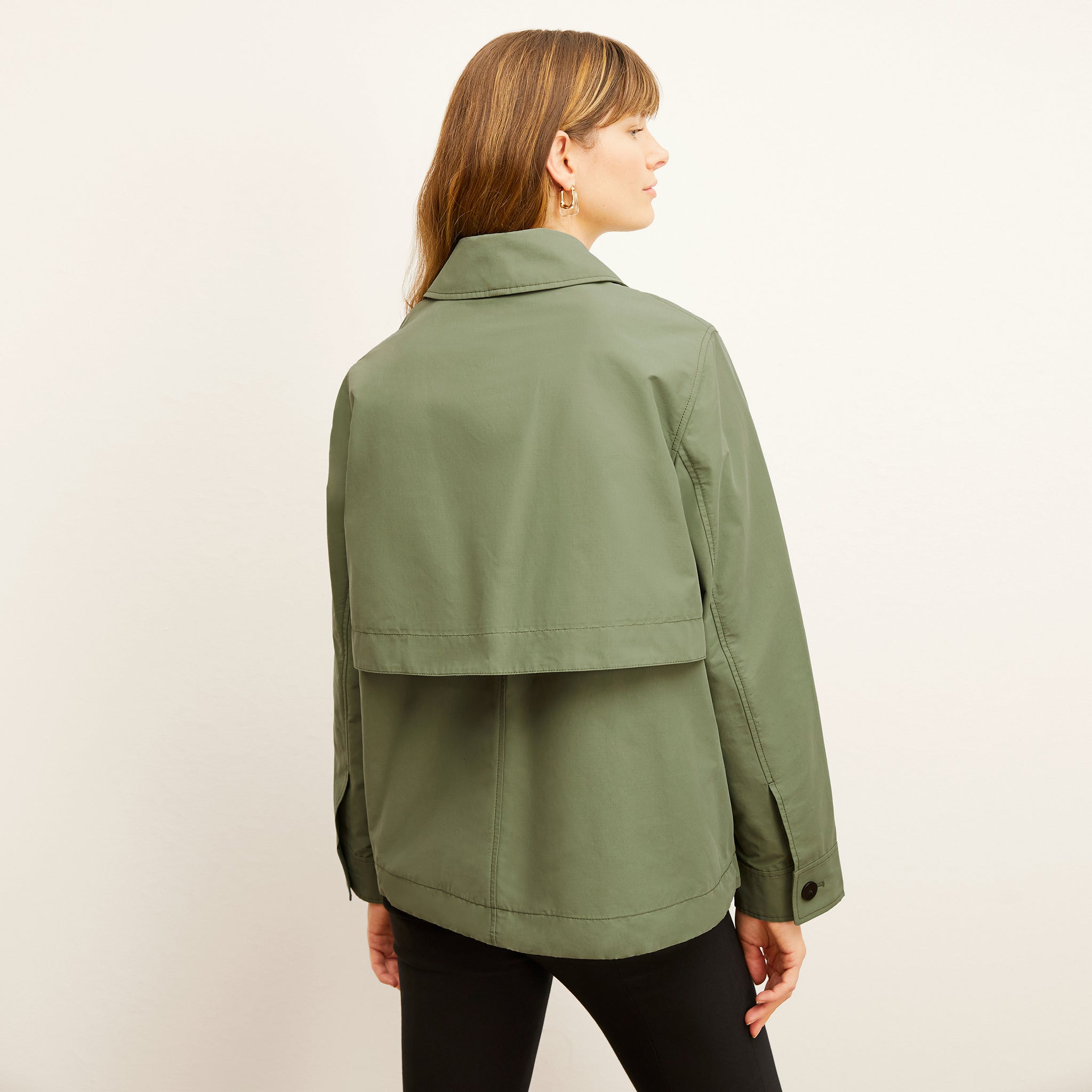 Back image of a woman wearing the Ness Jacket