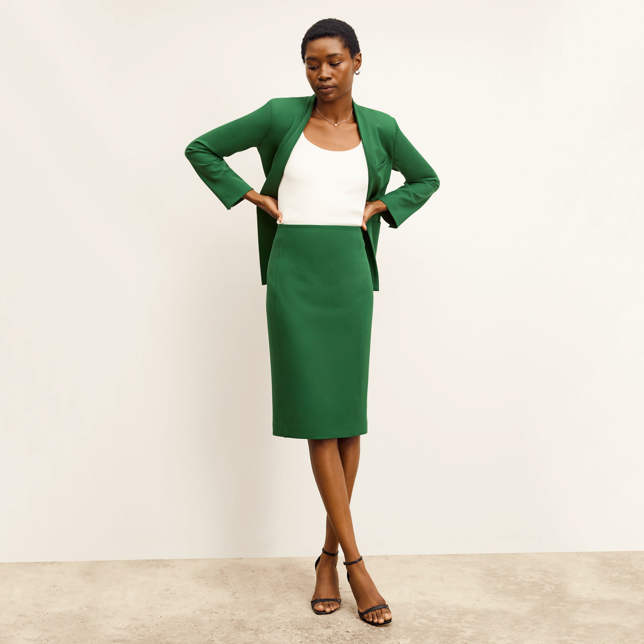 front image of a woman wearing the chantal skirt in shamrock