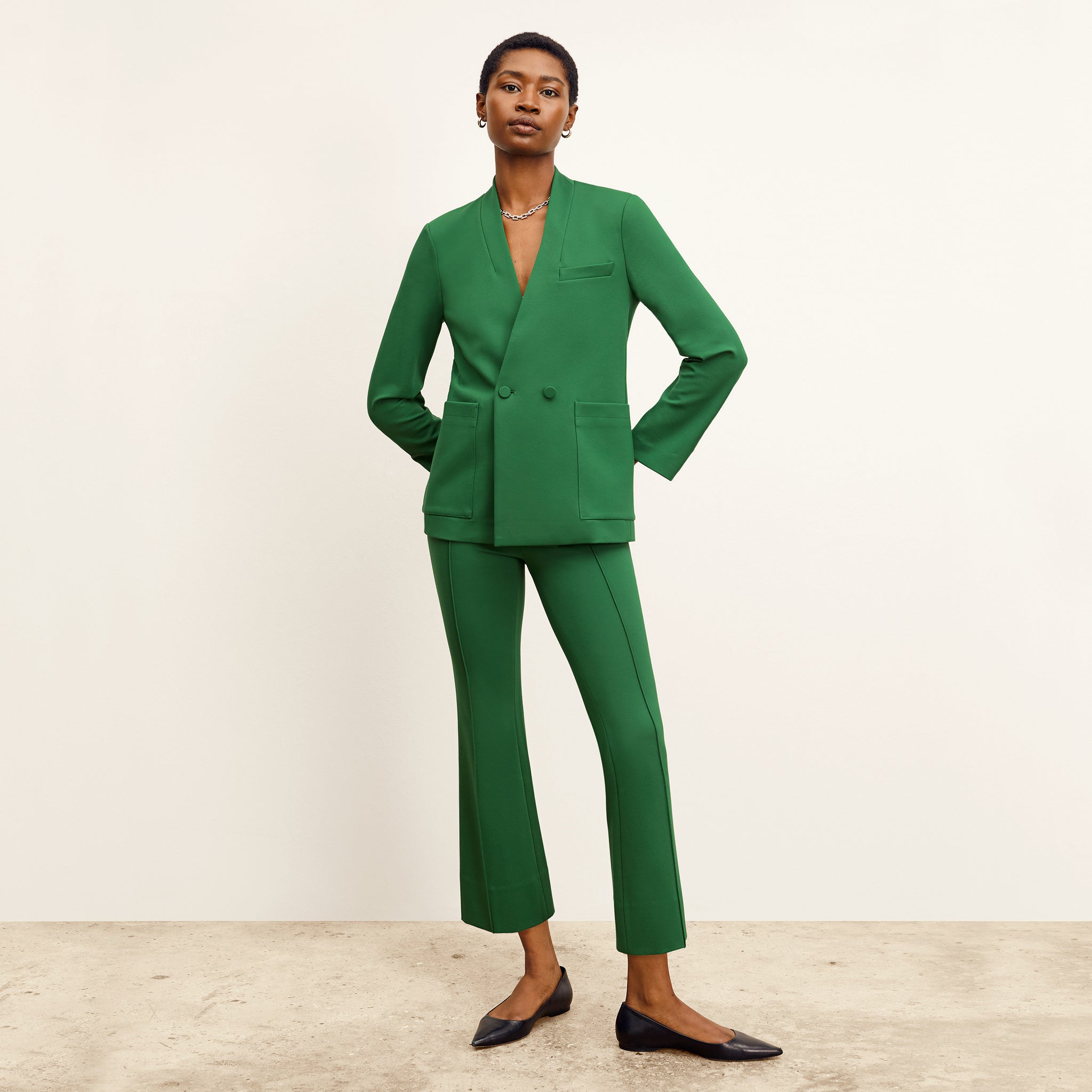 front image of a woman wearing the allyn pants in shamrock 