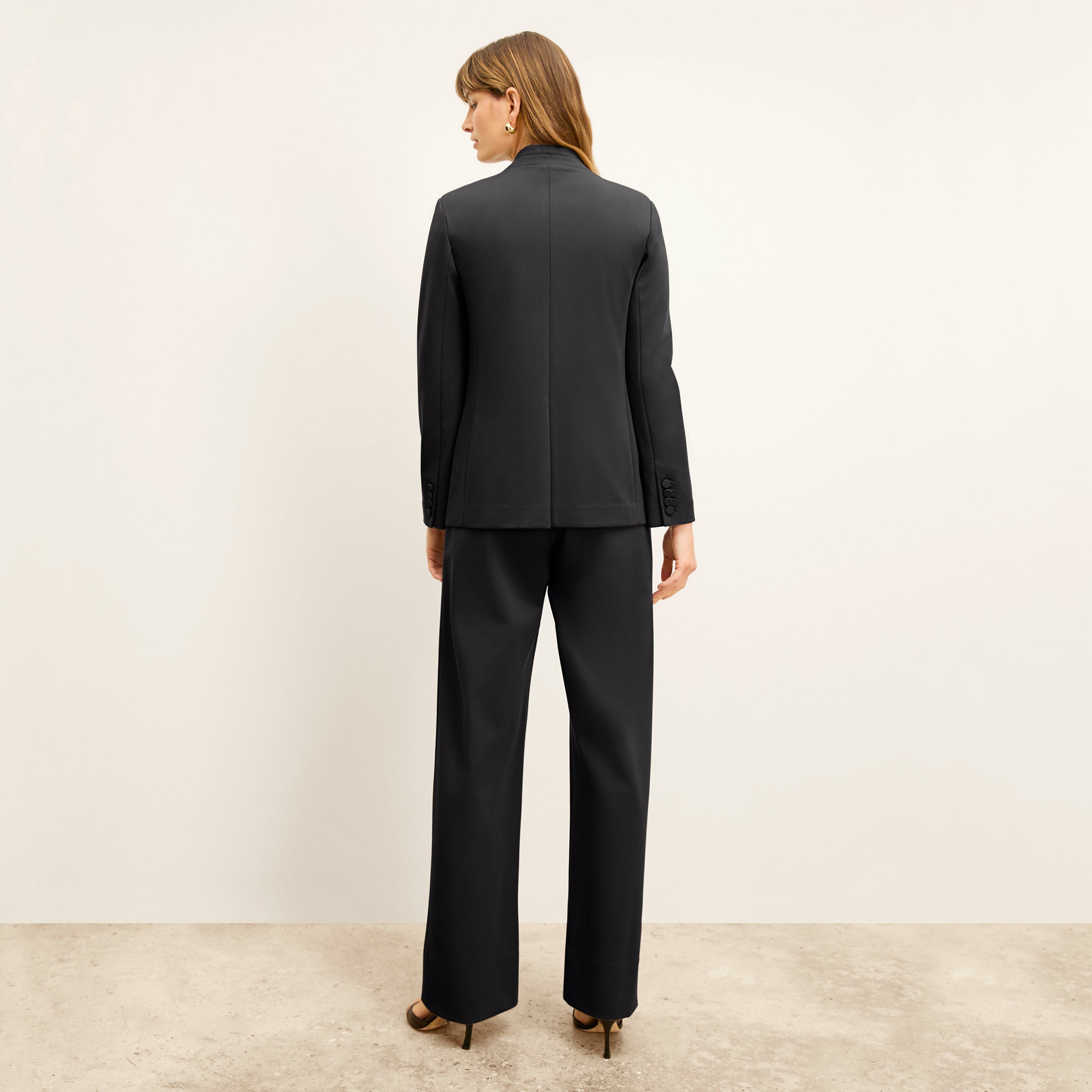 back image of a woman wearing the janette blazer in black