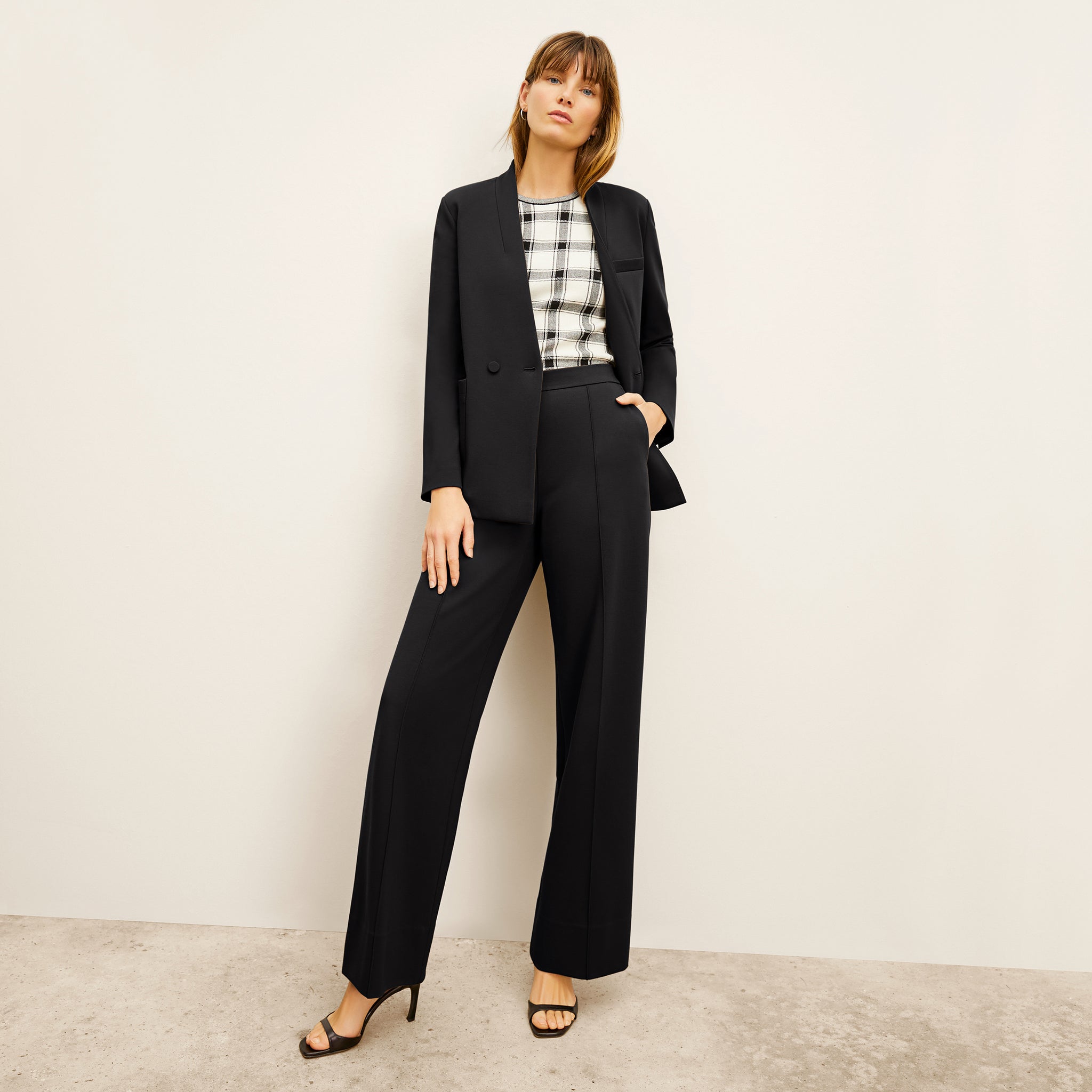 front image of a woman wearing the janette blazer in black