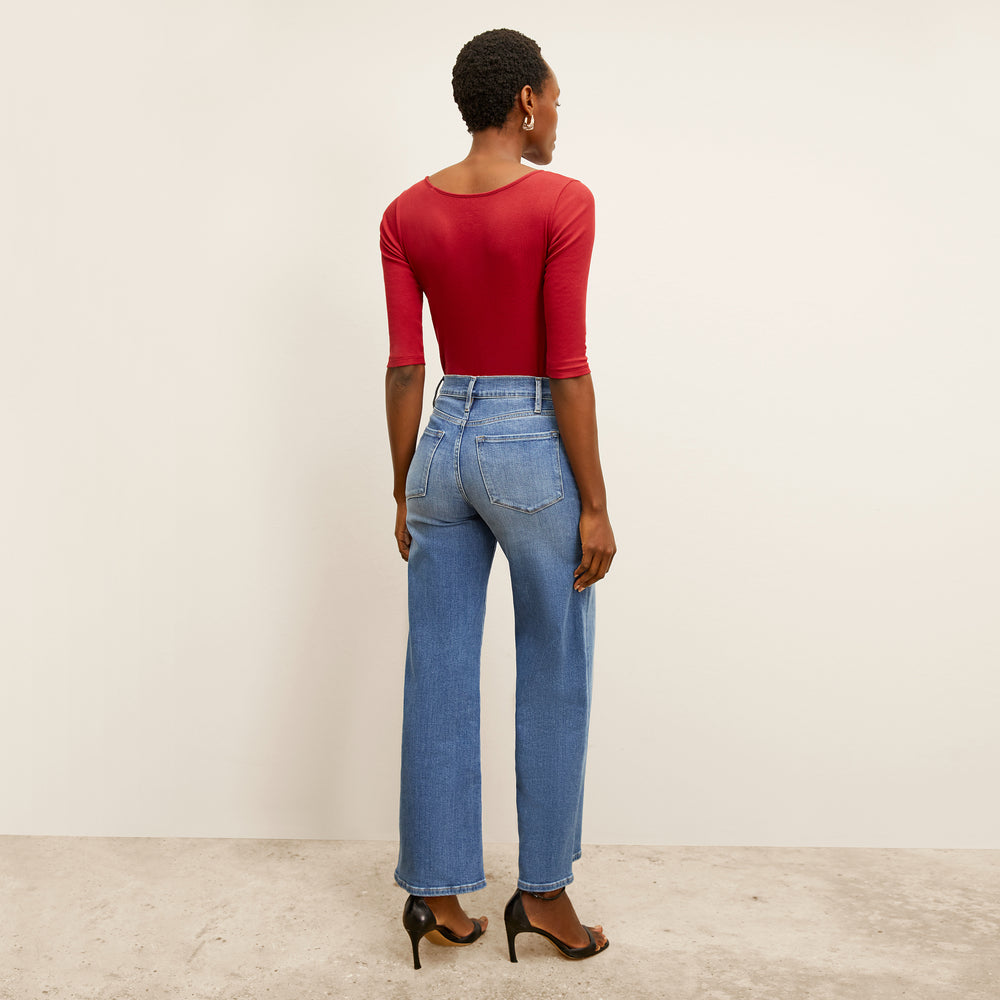 back image of a woman wearing the soyoung t-shirt in cardinal