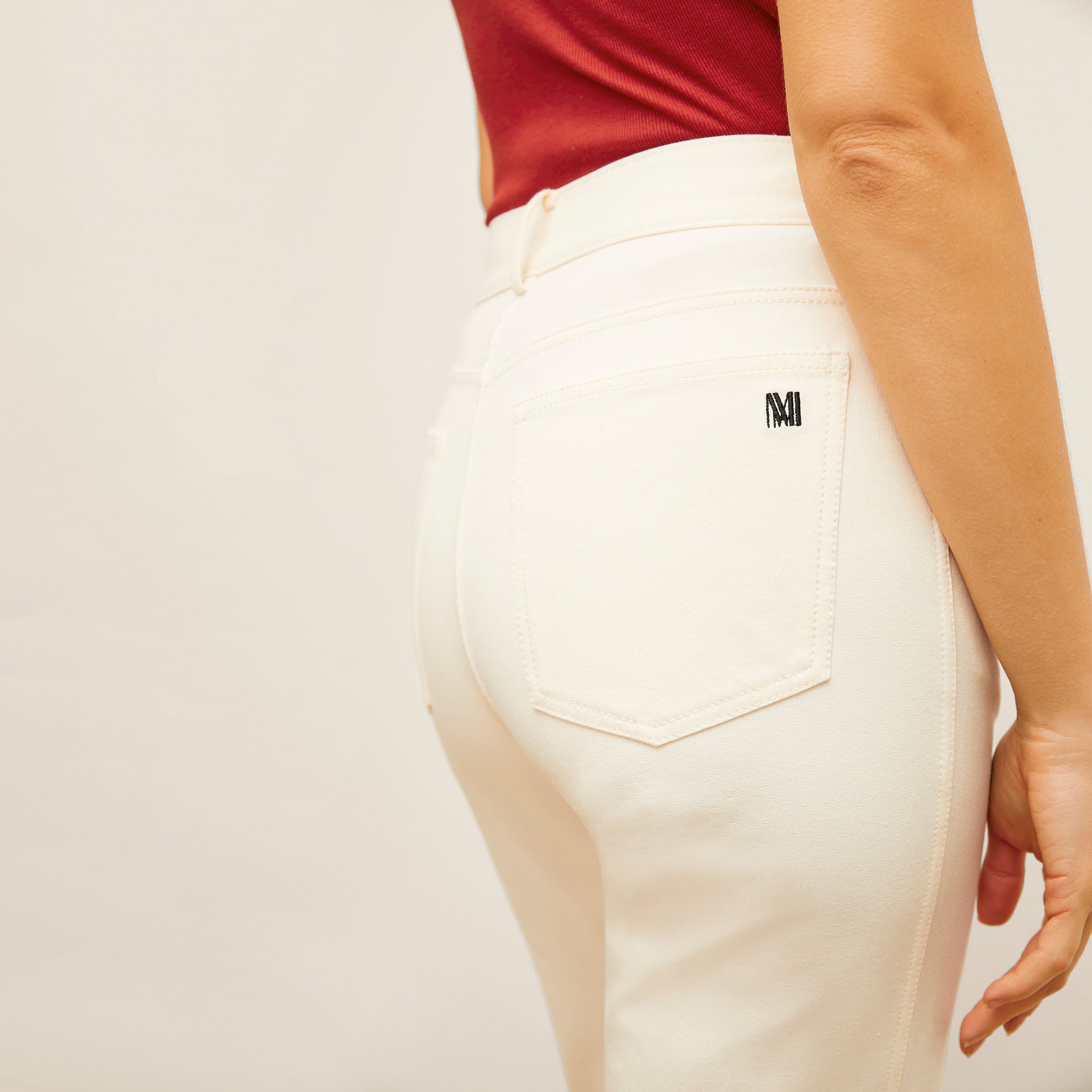 detail image of the M.M. LaFleur Logo on the back pocket of the jean
