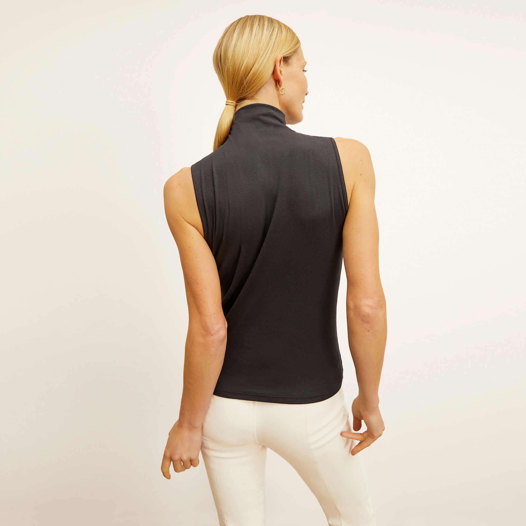 back image of a woman wearing the jett t-shirt in black