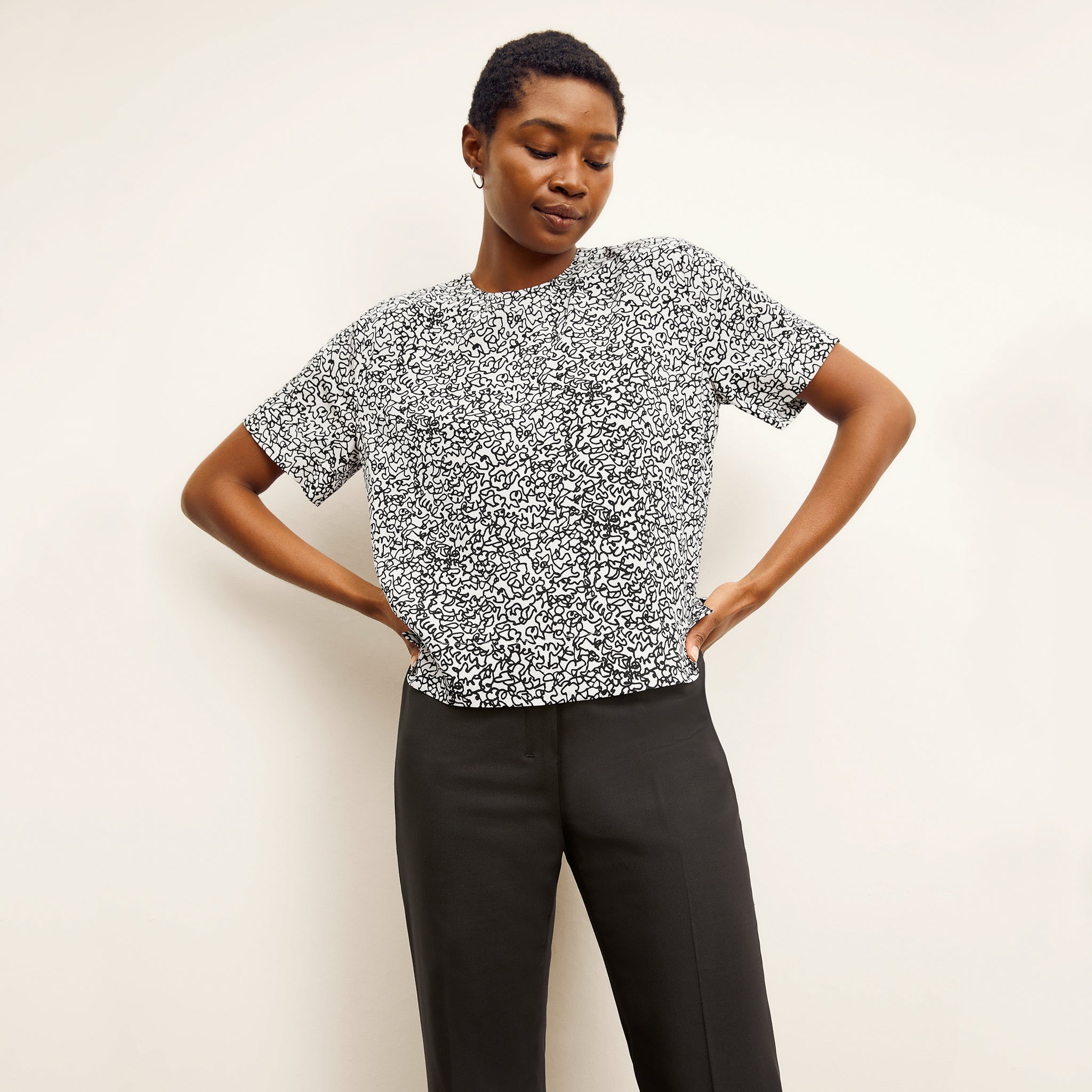 front image of a woman wearing the annika top in scribble print 