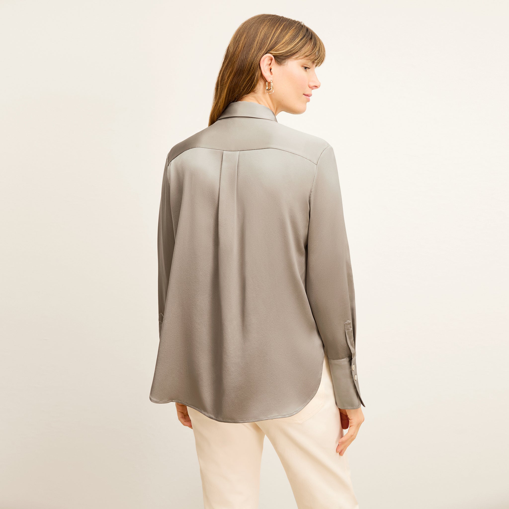 back image of a woman wearing the tatum top in dune