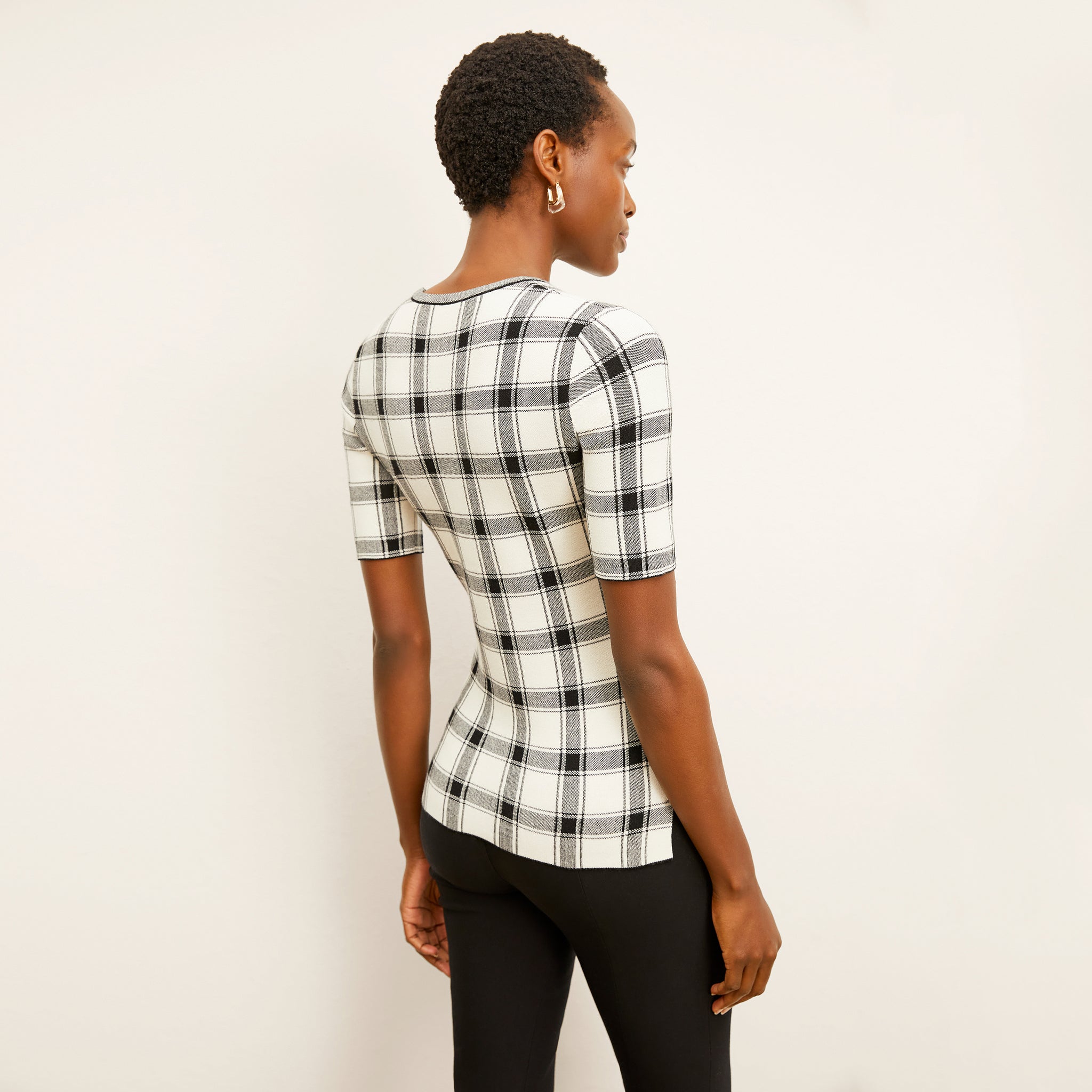 Back image of a woman wearing the Choe top