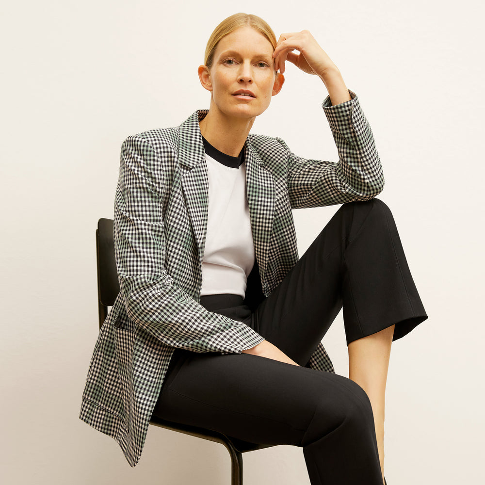 front image of a woman wearing the dolly jacket in check plaid