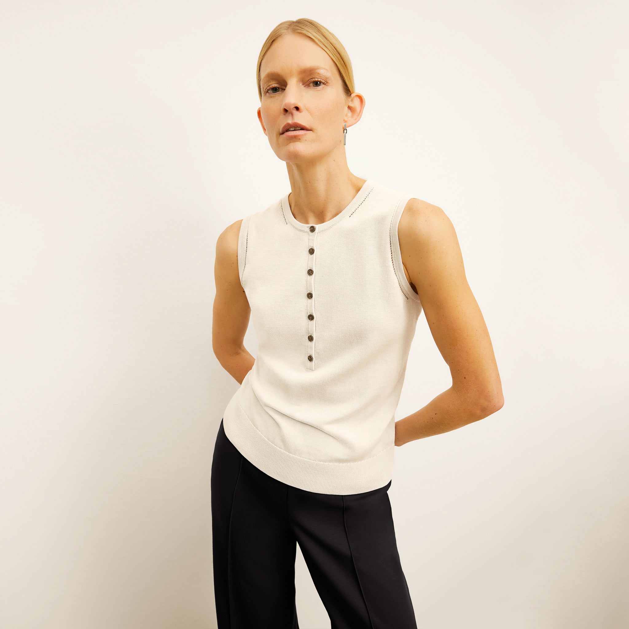 front image of a woman wearing the crimmins top in ivory 