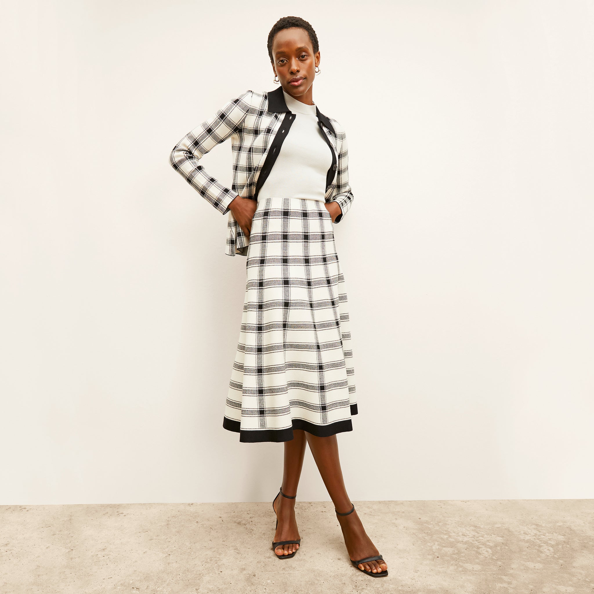 front image of a woman wearing the marlowe skirt in bold check 