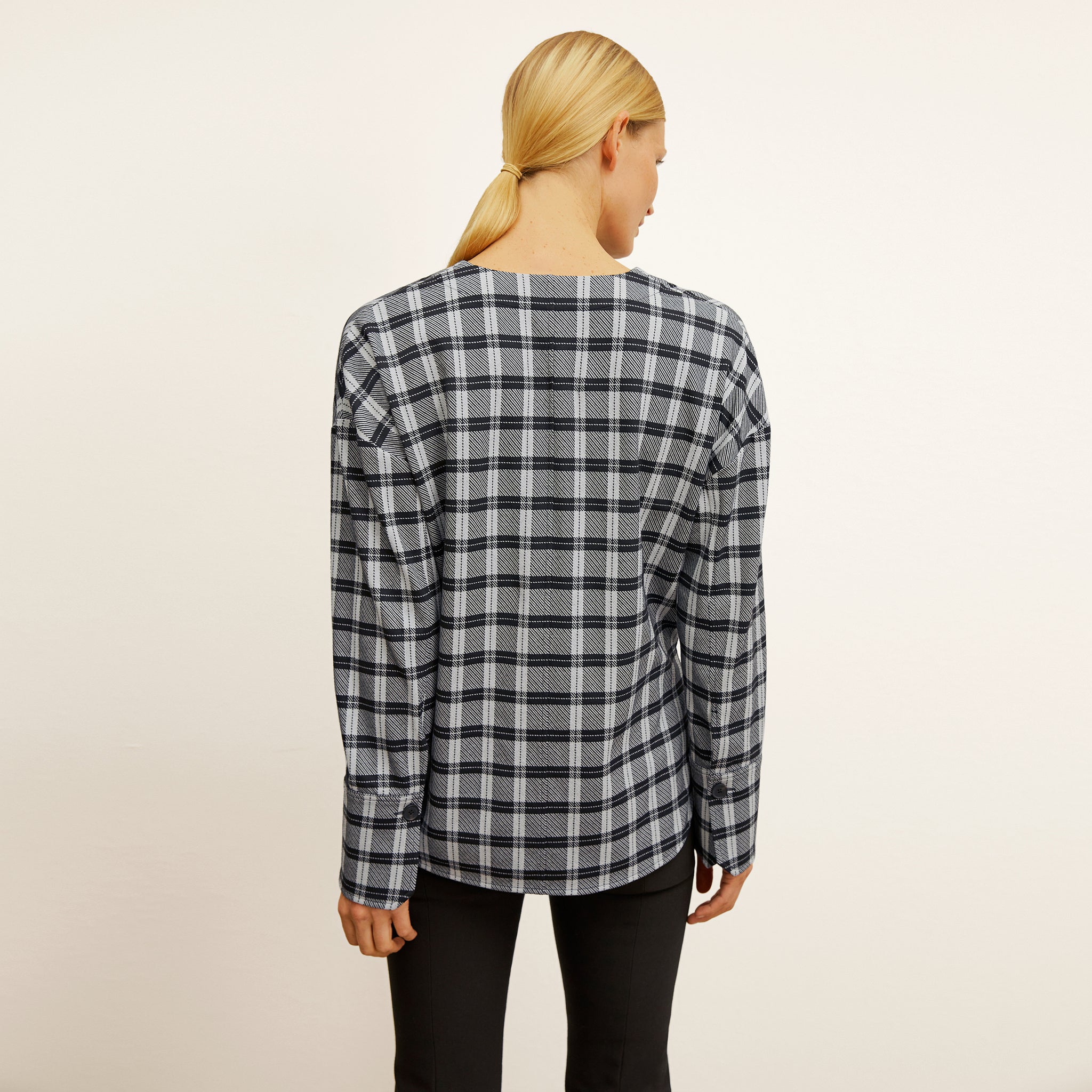 back image of a woman wearing the tully top in checkmate