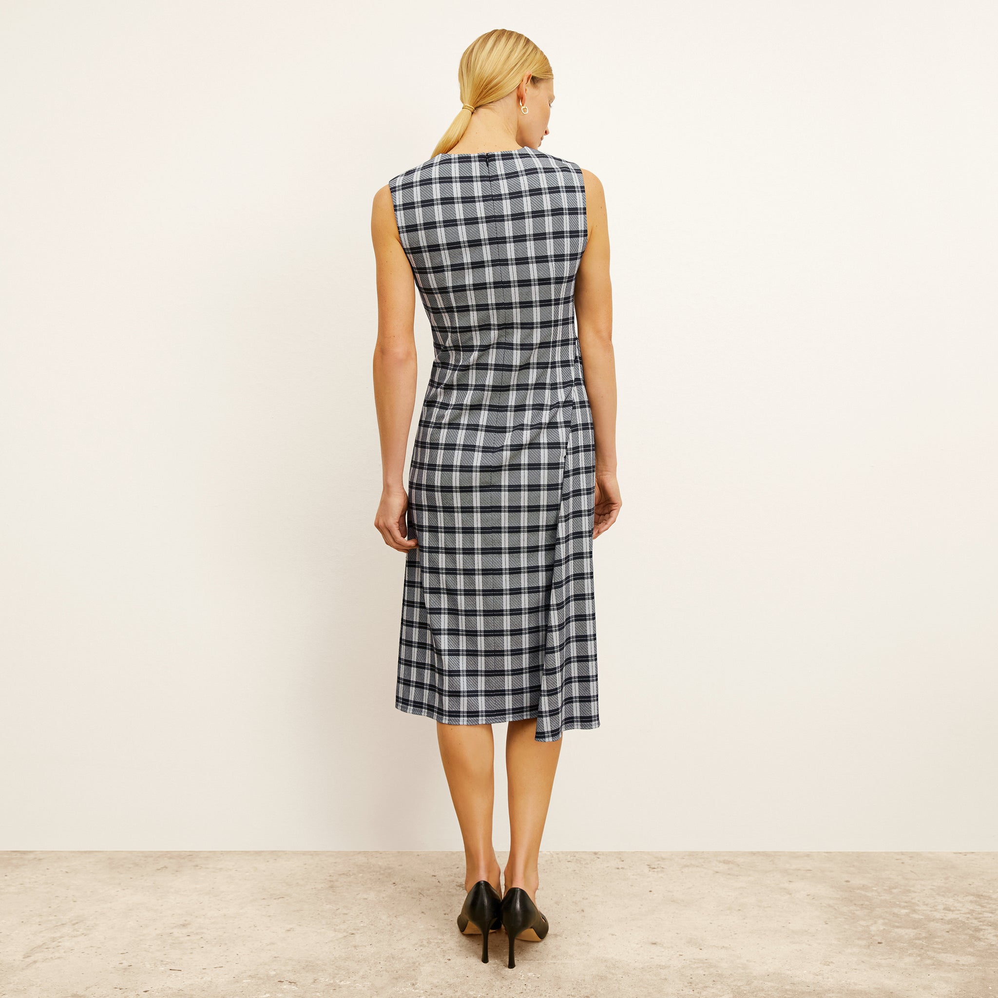back image of a woman wearing the jeannine dress in checkmate