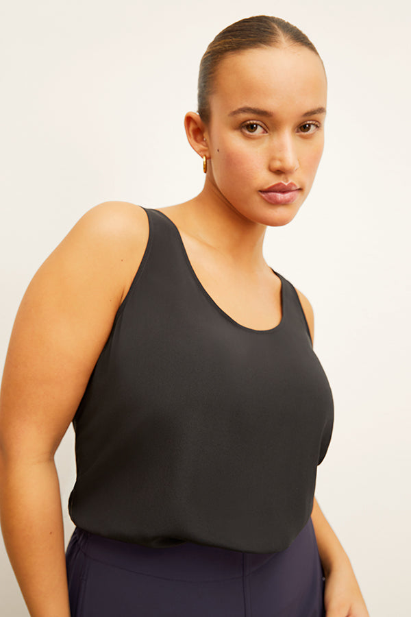 Front image of a woman wearing the Vicky Tank in Black