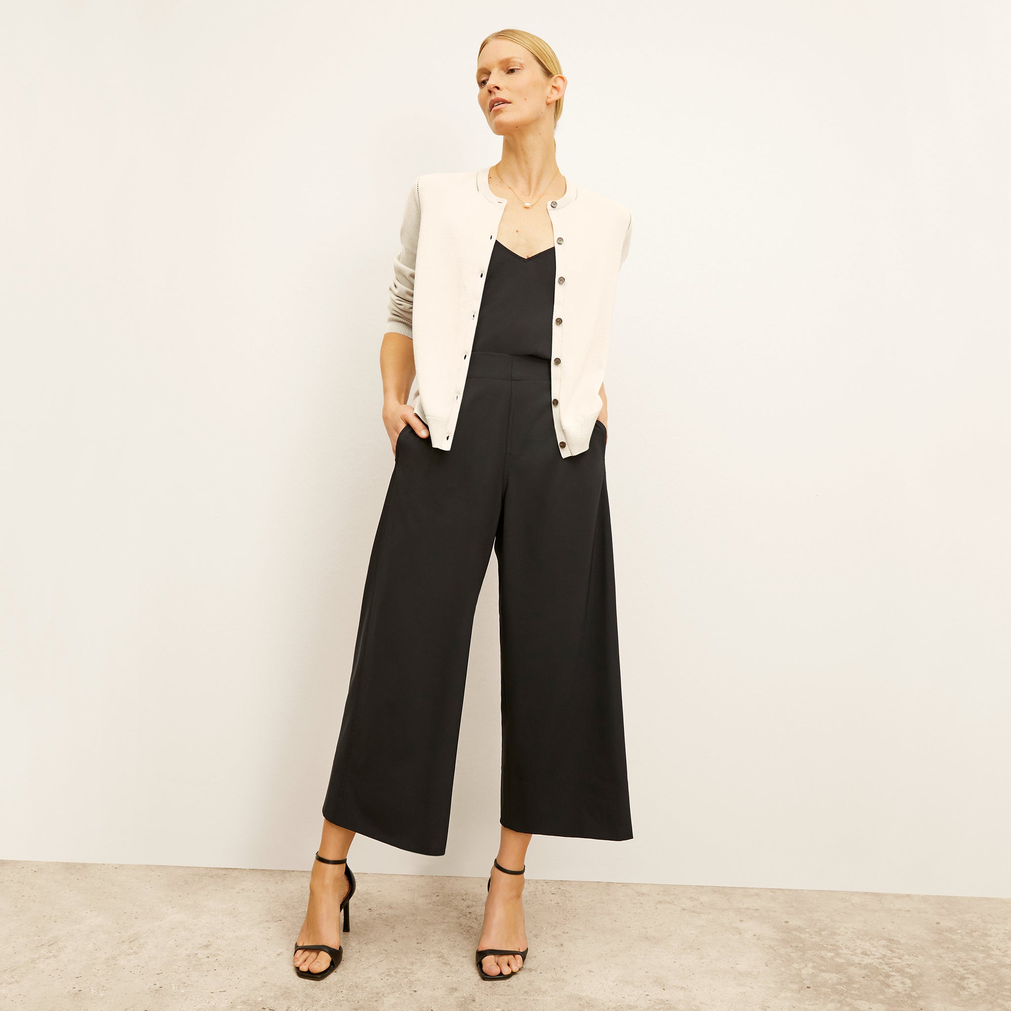front image of a woman wearing the elena pants in black