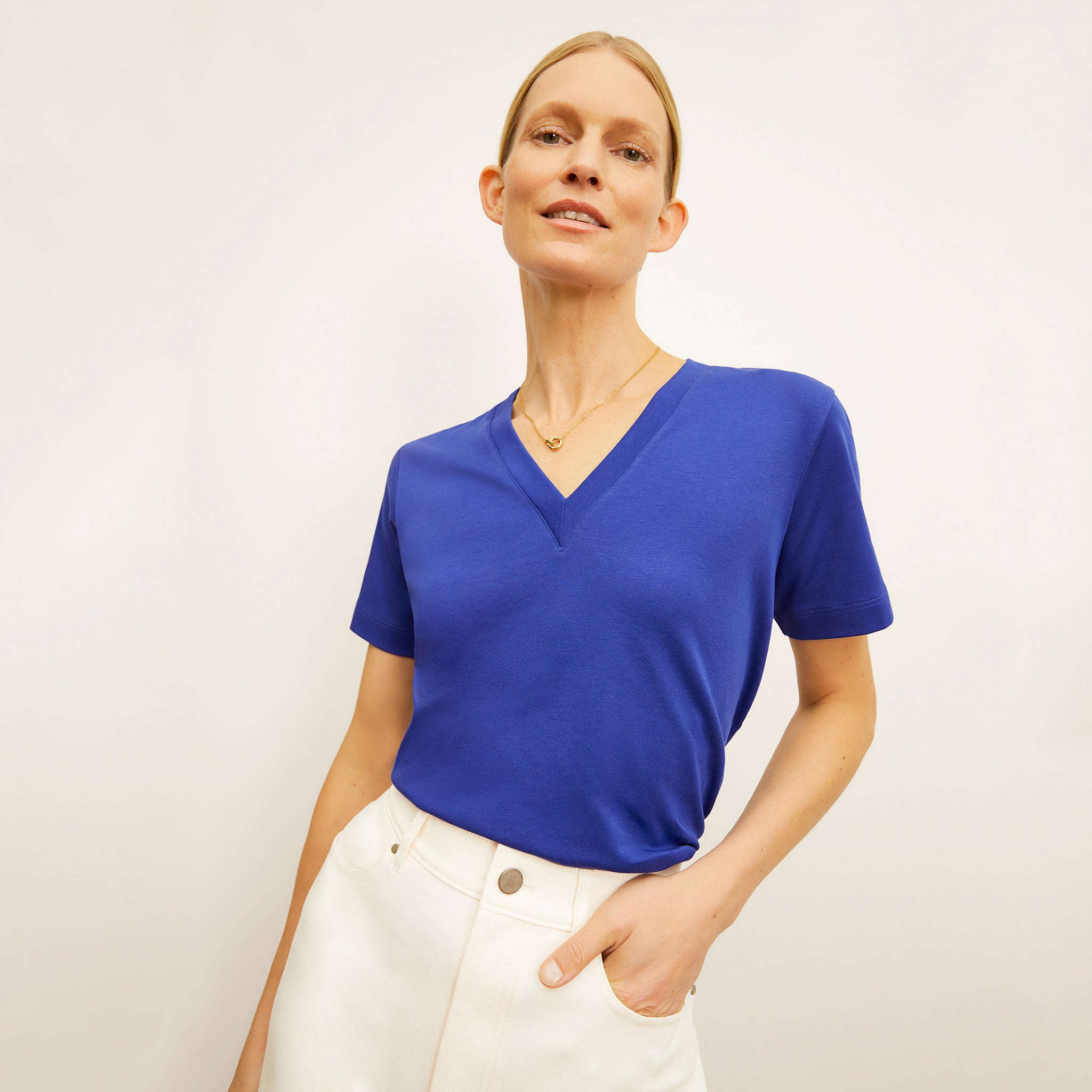 front image of a woman wearing the lee t-shirt in bright indigo 