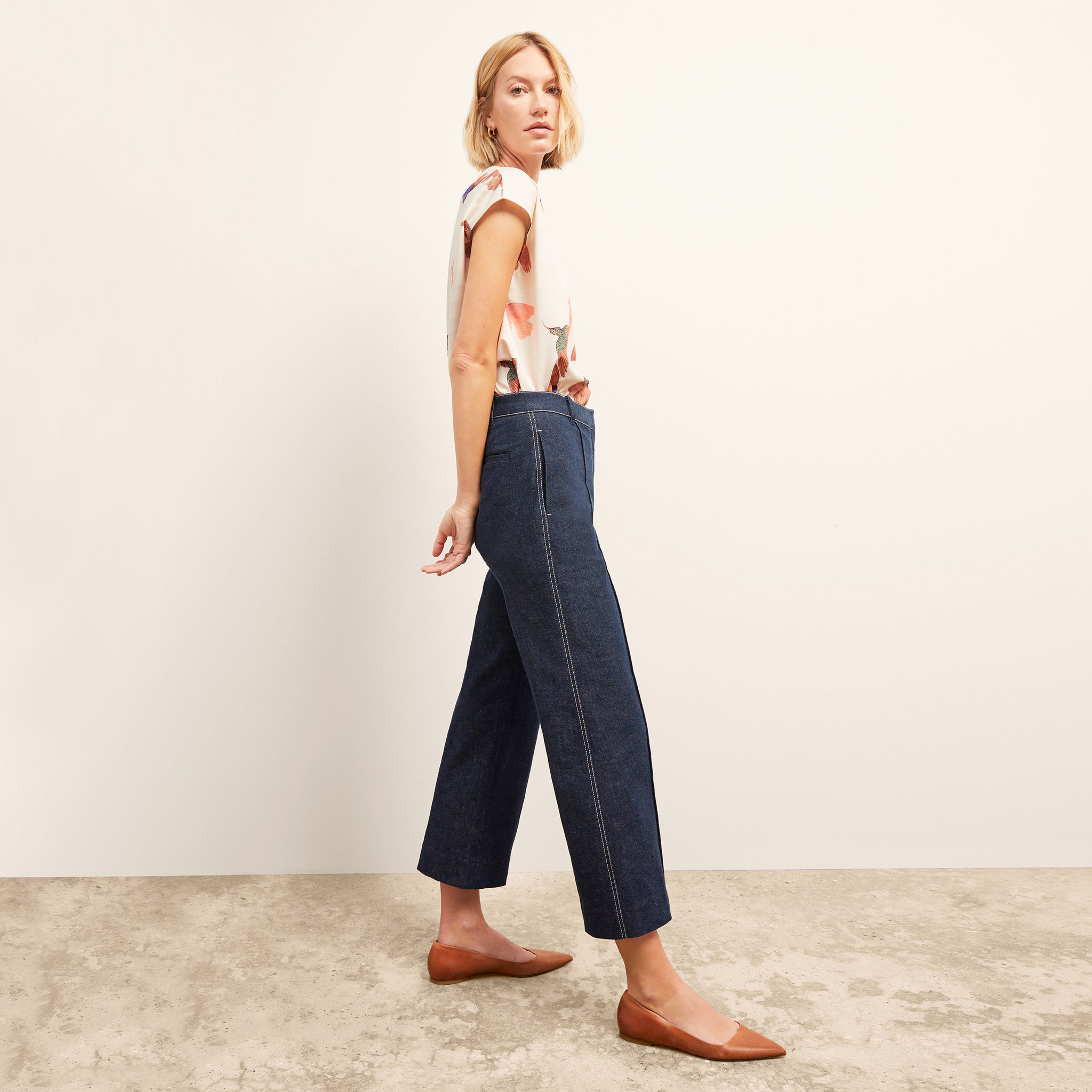 side image of a woman wearing the christy pant in dark wash