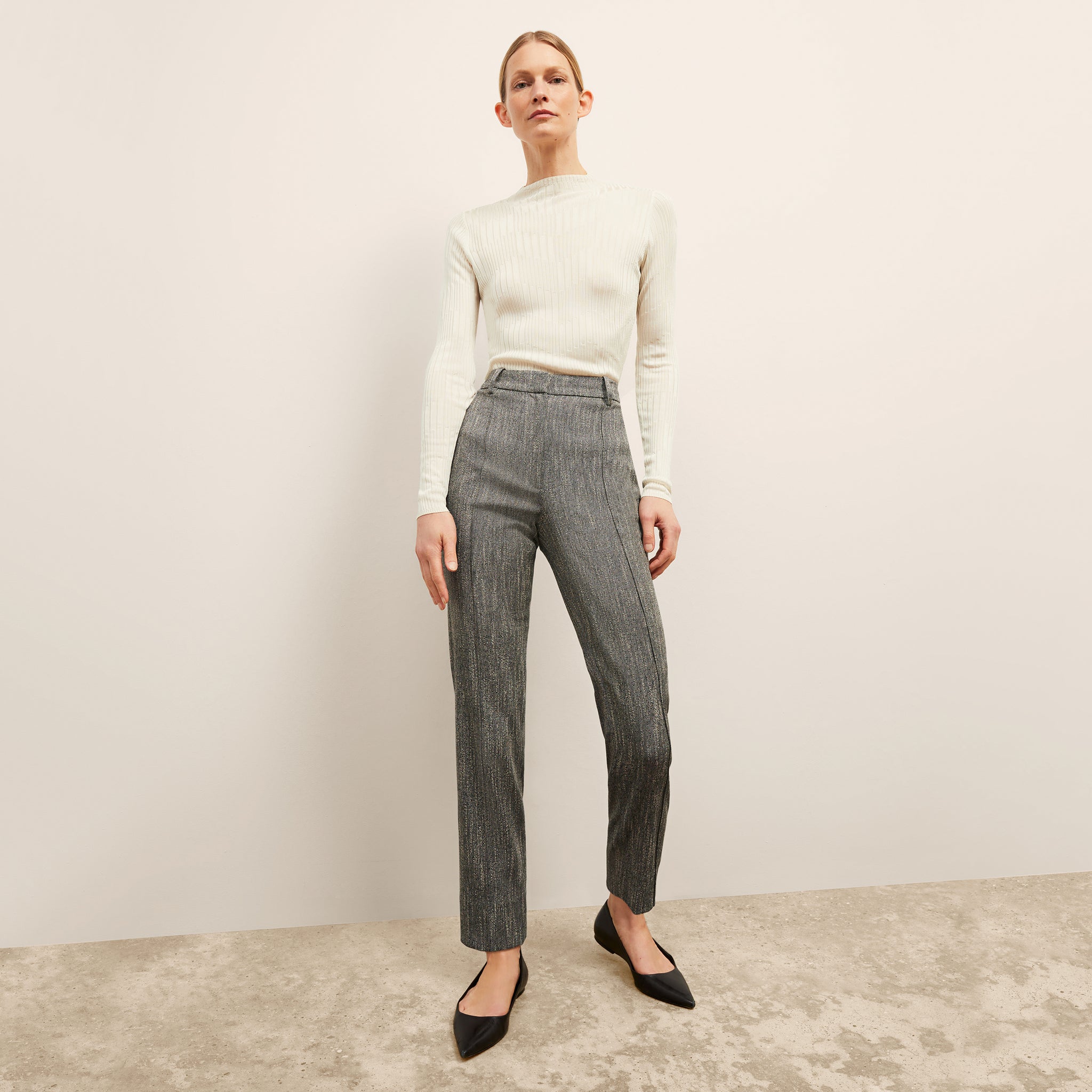 front image of a woman wearing the pearl pant in black/ivory 
