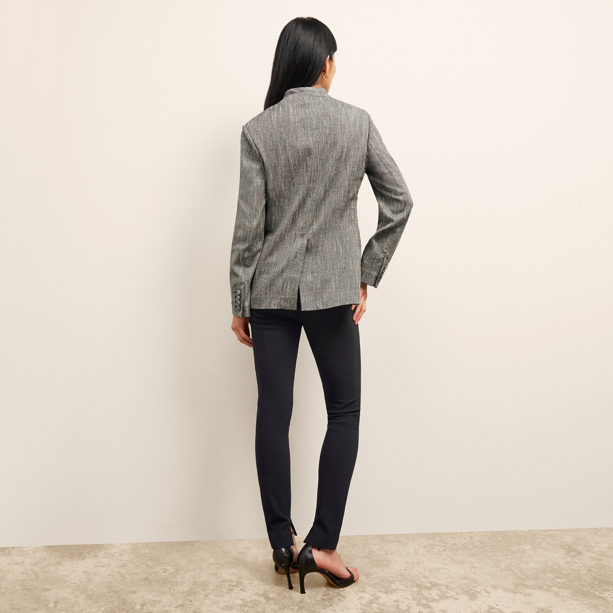 back image of a woman wearing the janette jacket in black/ivory