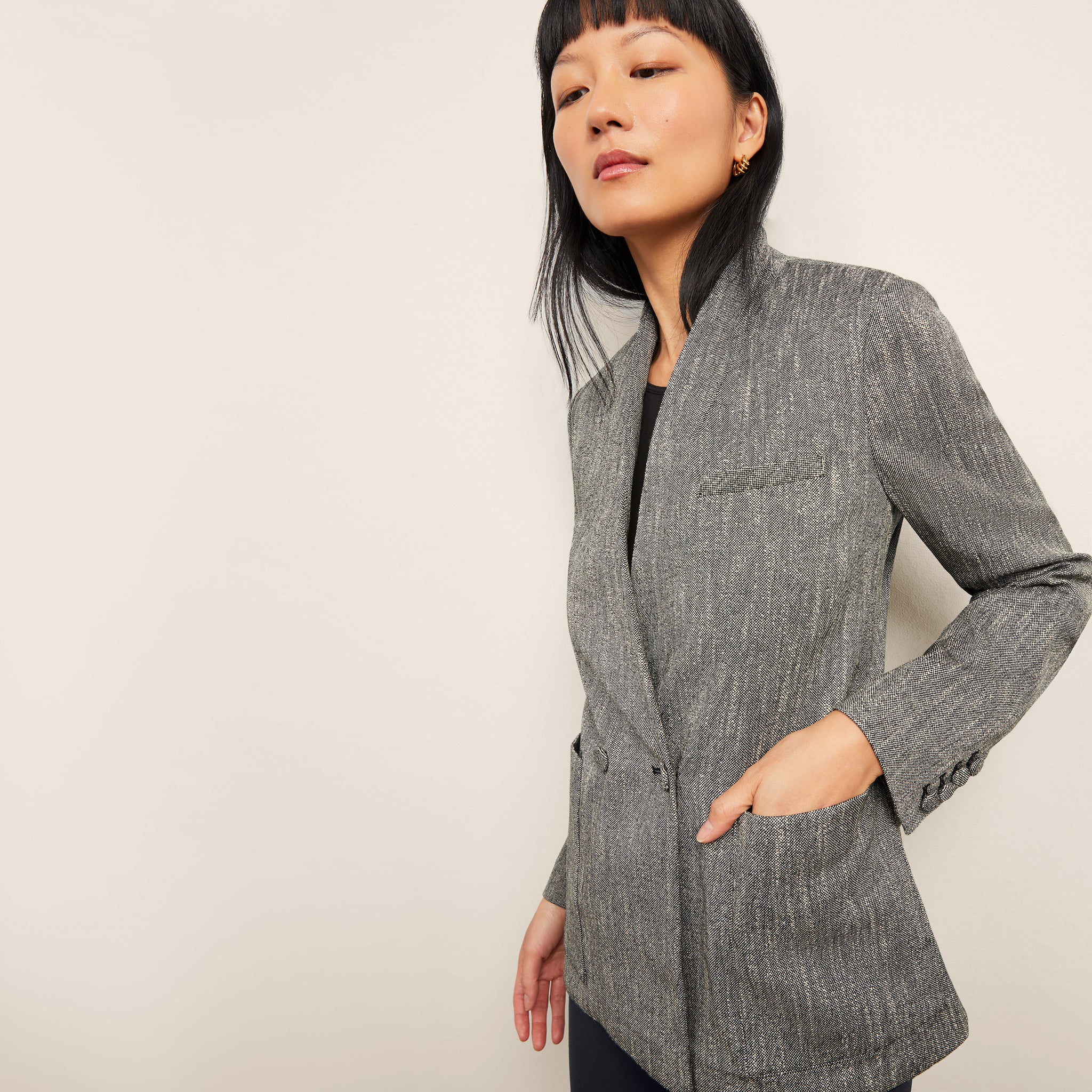 front image of a woman wearing the janette jacket in black/ivory