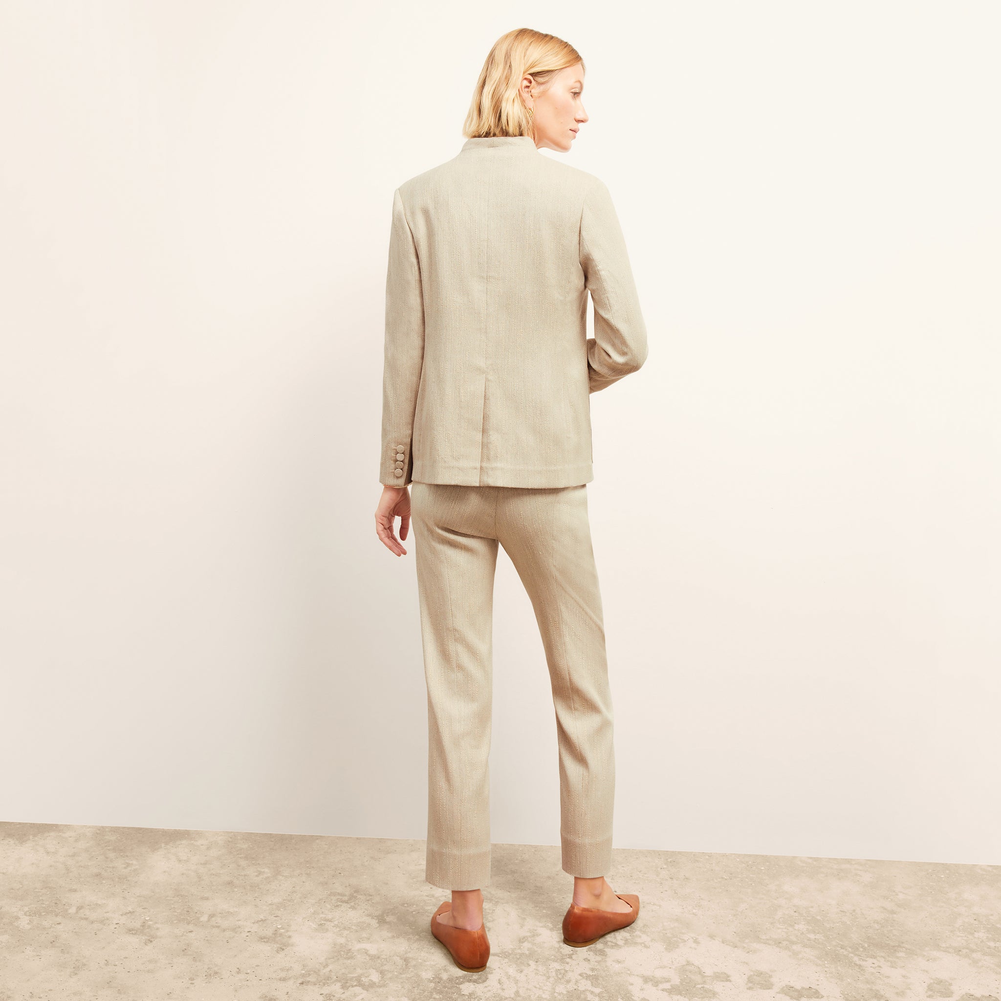 Back image of a woman wearing the Janette Jacket in ivory