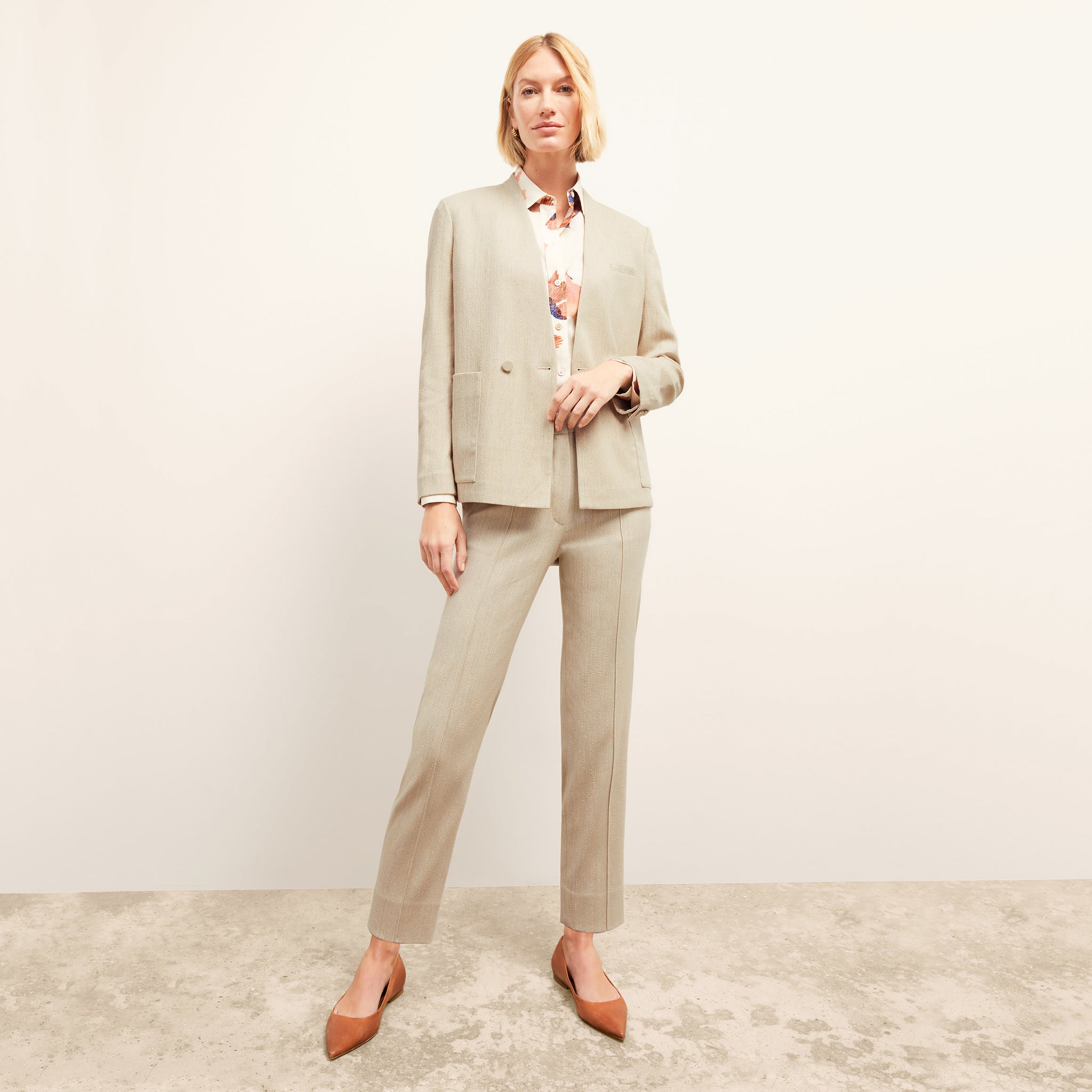 Front image of a woman wearing the Janette Jacket in ivory 